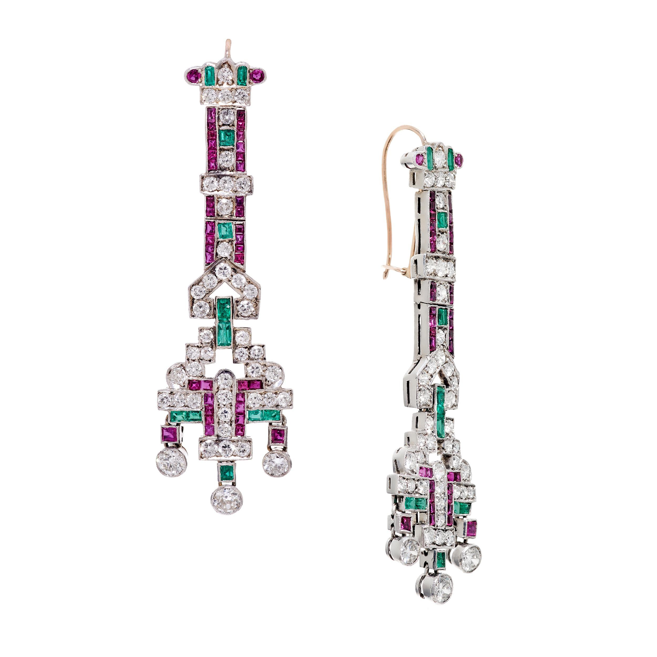 Absolutely stunning earrings from the early 20th century.  They sit so perfectly on the ear without the slightest pulling.  I reference these earrings as the perfect dangle.  

Gemstone Detail
Rubies Approximate Weight 3.20 Carats
- 4 Round Rubies
