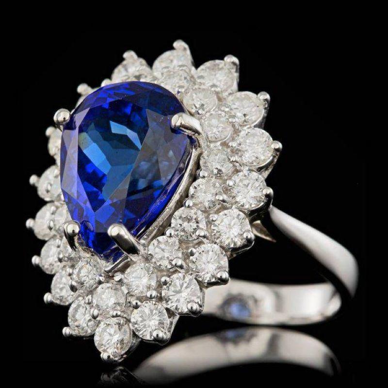 8.70 Carats Natural Tanzanite and Diamond 18K Solid White Gold Ring

Total Natural Tanzanite Weight is: Approx. 6.40 Carats 

Tanzanite Measures: Approx. 13.00 x 10.00mm

Natural Round Diamonds Weight: Approx. 2.30 Carats (color G-H / Clarity