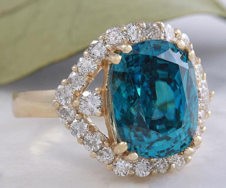 8.70 Carats Natural Very Nice Looking Blue Zircon and Diamond 14K Yellow Gold Ring

Suggested Replacement Value: 9,000.00

Total Natural Cushion Shaped Zircon Weights: Approx. 7.80 Carats

Zircon Measures: 11 x 8.4mm

Natural Round Diamonds Weight: