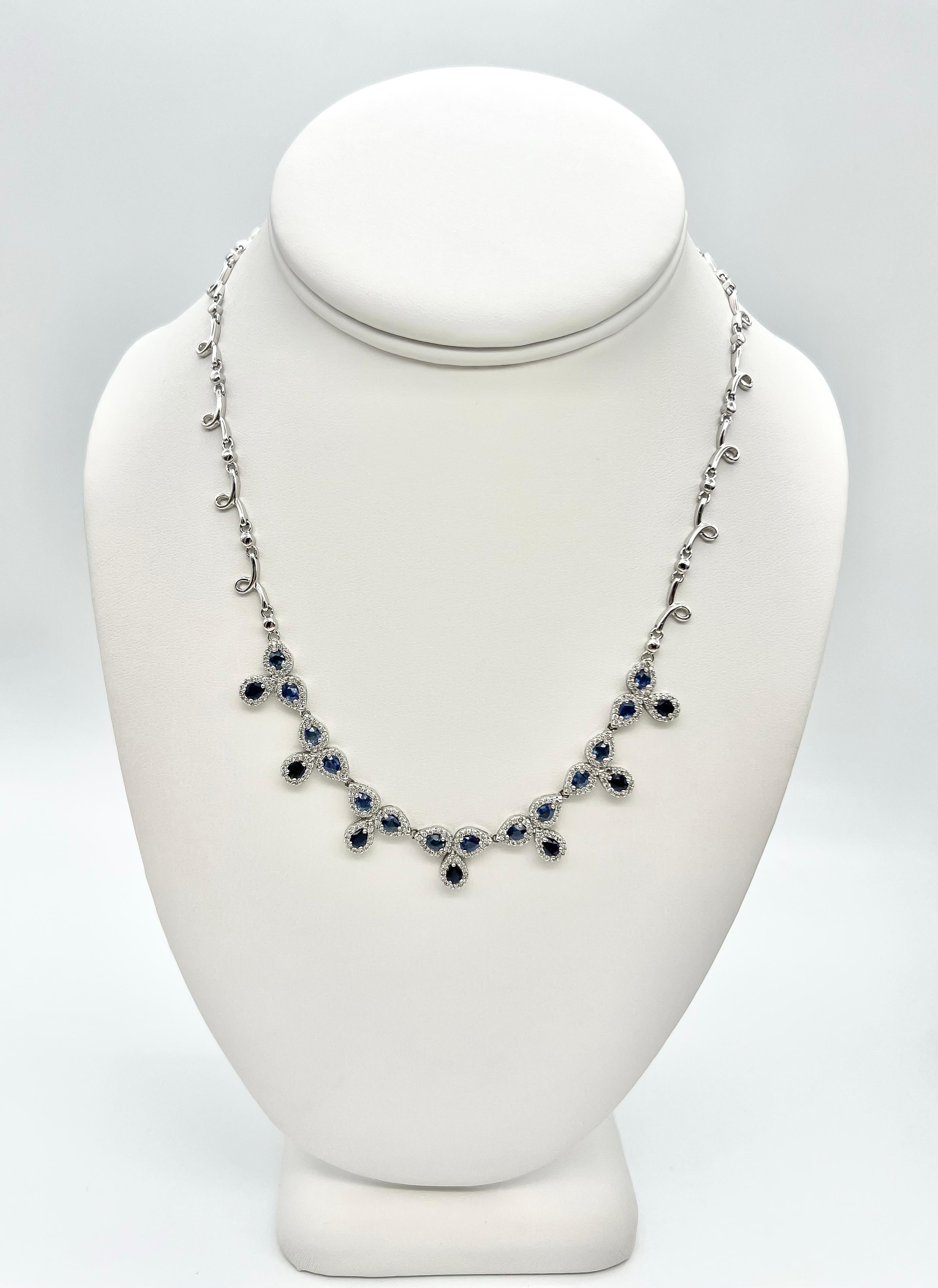 8.70 Total Carat Fancy Sapphire and Diamond, White Gold Necklace

Intricately crafted sapphire diamond necklace. This necklace boasts a total of 6.00 Carat pear shape Sapphires juxtaposed in trios. Each of these sapphire clusters is surrounded with