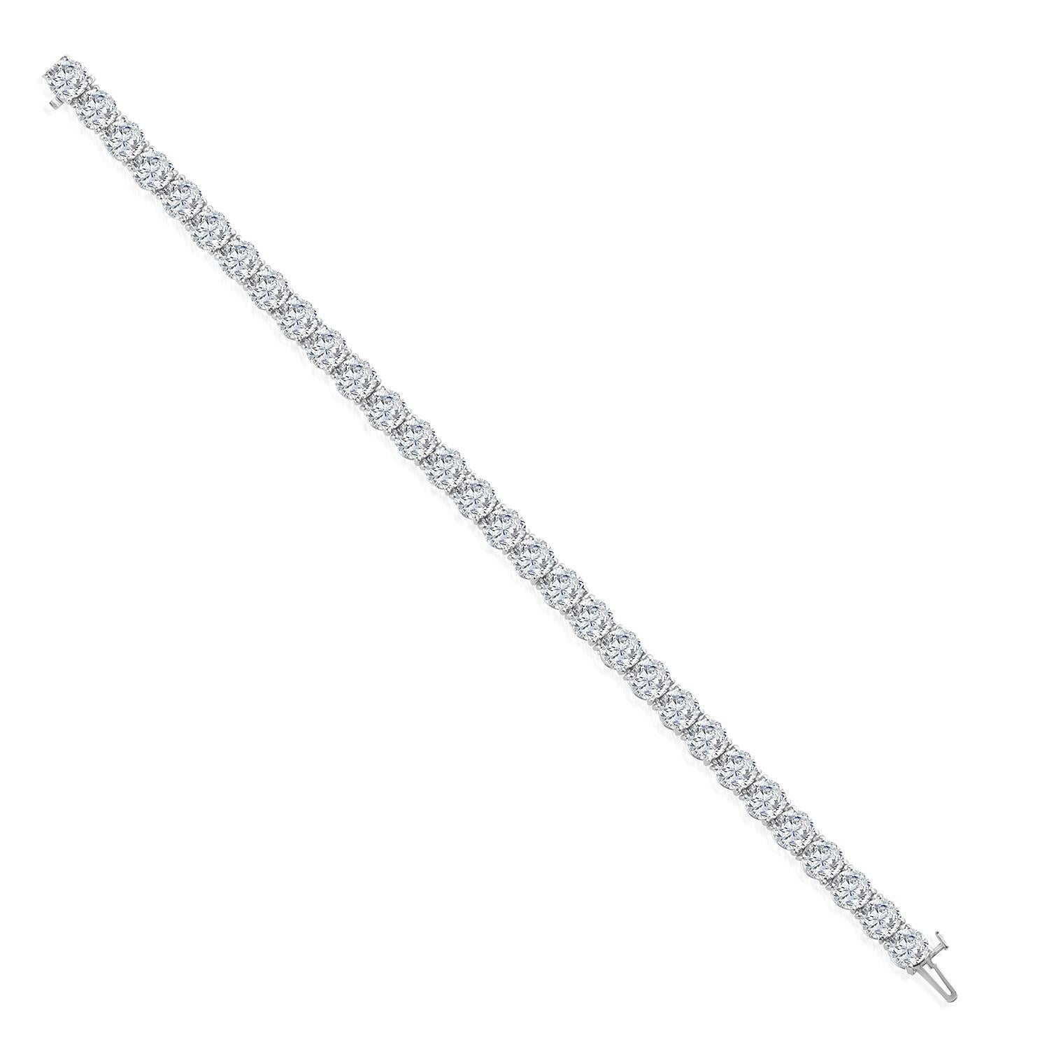 This gorgeous diamond tennis bracelet weighing 8.73 total carat weight set in hand made 18k white gold. Featuring ideal brilliant round cut diamonds ,for maximum brilliance. The incredible diamonds are F-G color and SI1 clarity.
Bracelet mesures 7