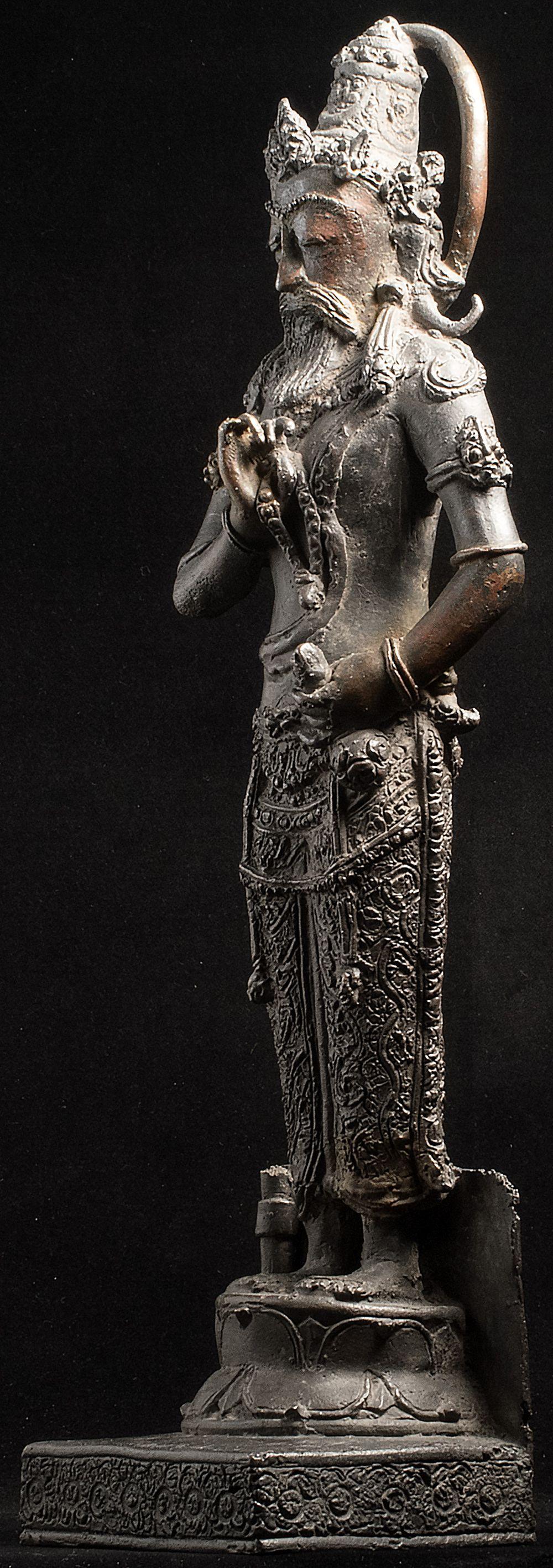 Early 20thC Indonesian (or other nearby island) depiction of Shiva. It likely had a trisula (3 pronged implement) in its right hand going all the way to the base, and possibly a back plate that broke off. It is one of the best of this type of piece