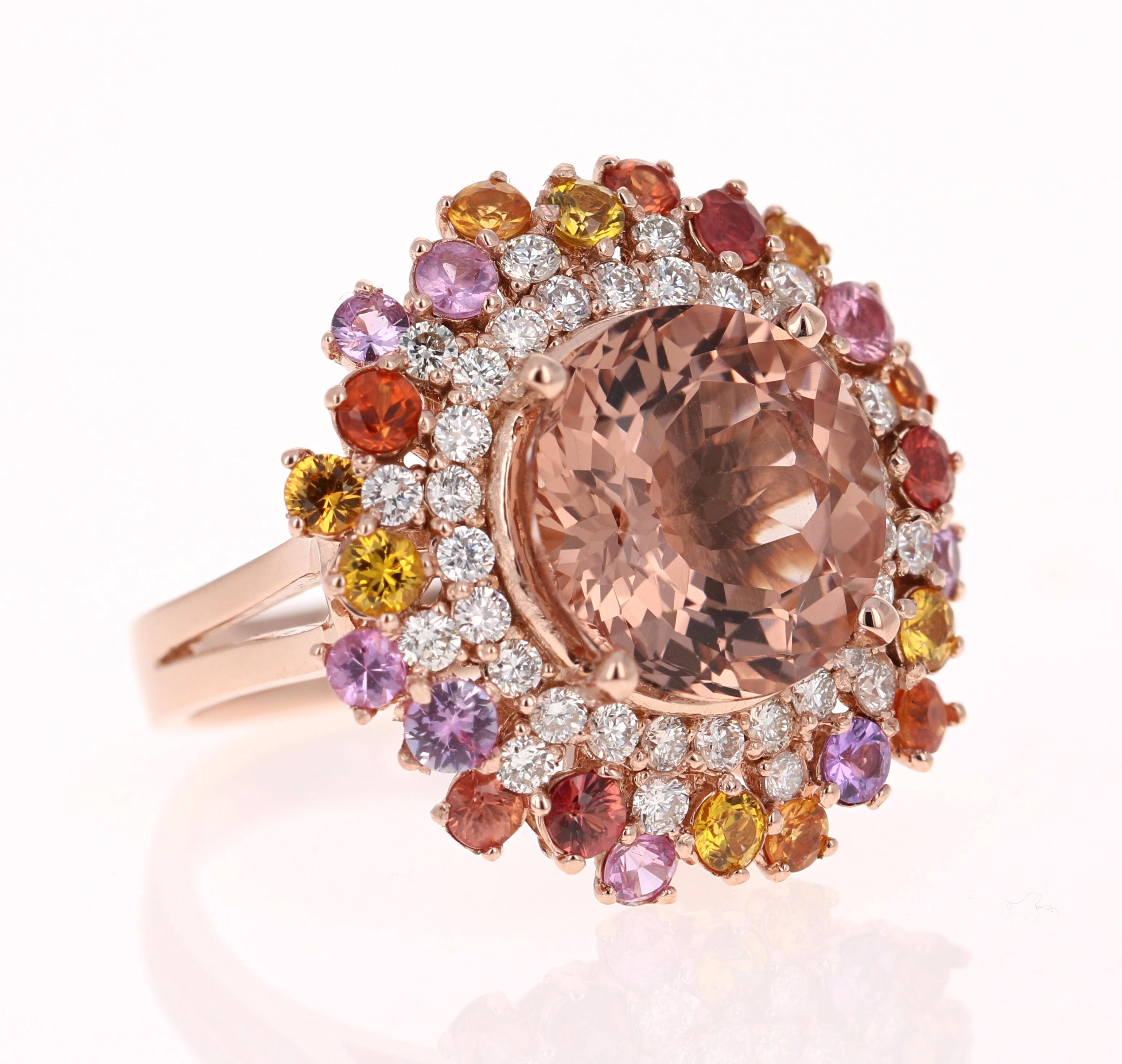 This gorgeous and unique Morganite Sapphire Diamond Ring has a 6.11 Carat Round Cut Morganite which is surrounded by Multi Colored Sapphires that weigh 1.80 Carats. It is further accented with 36 Round Cut Diamonds that weigh 0.83 Carats (Clarity: