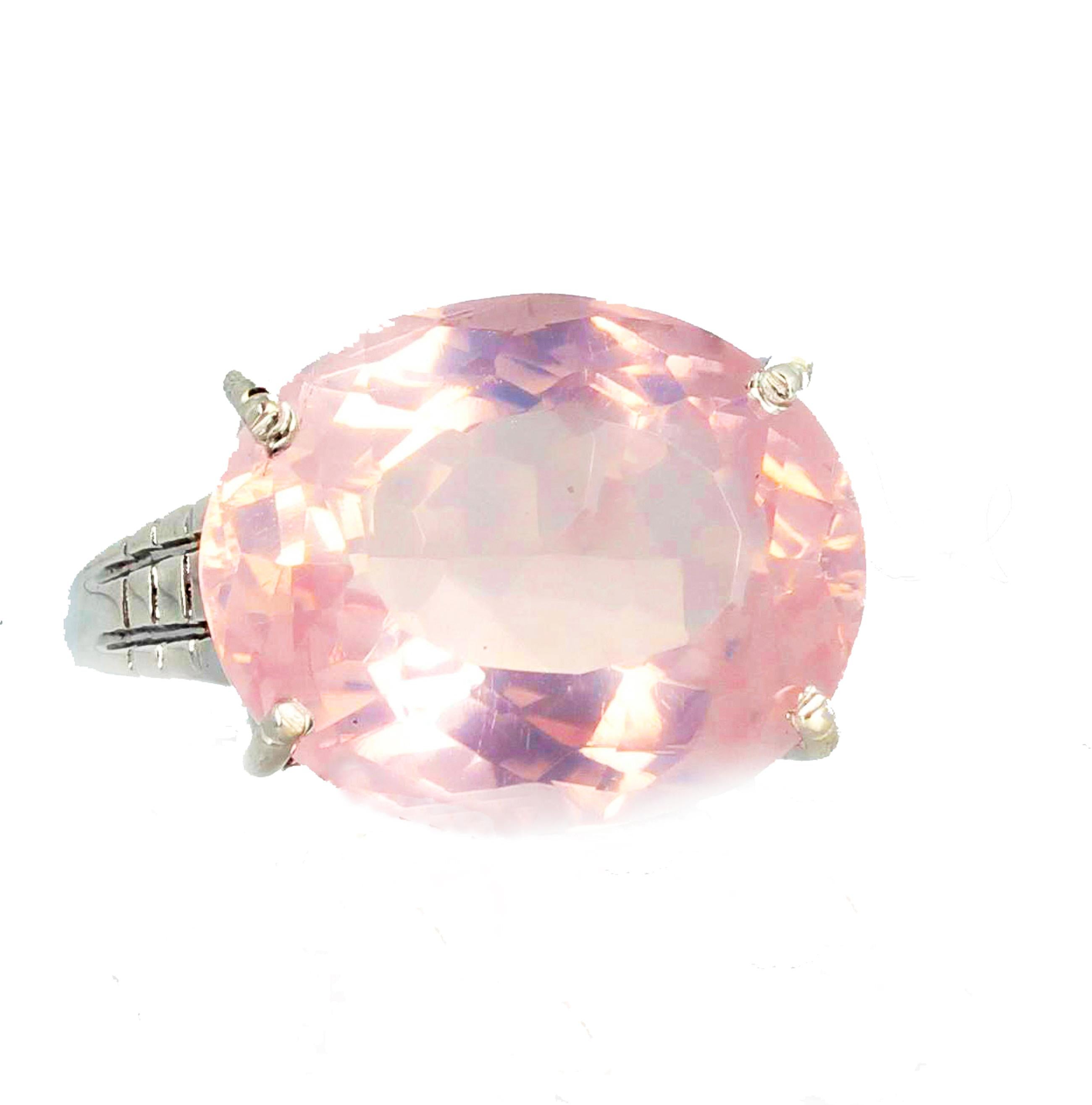 Glittering beautiful unique large gem cut 16 mm x 12 mm natural Rose Quartz is set in a rhodium plated sterling silver ring size 7 (sizable).  This beautiful Rose Quartz sits up sideways on the ring so it glitters substantially.  More from this