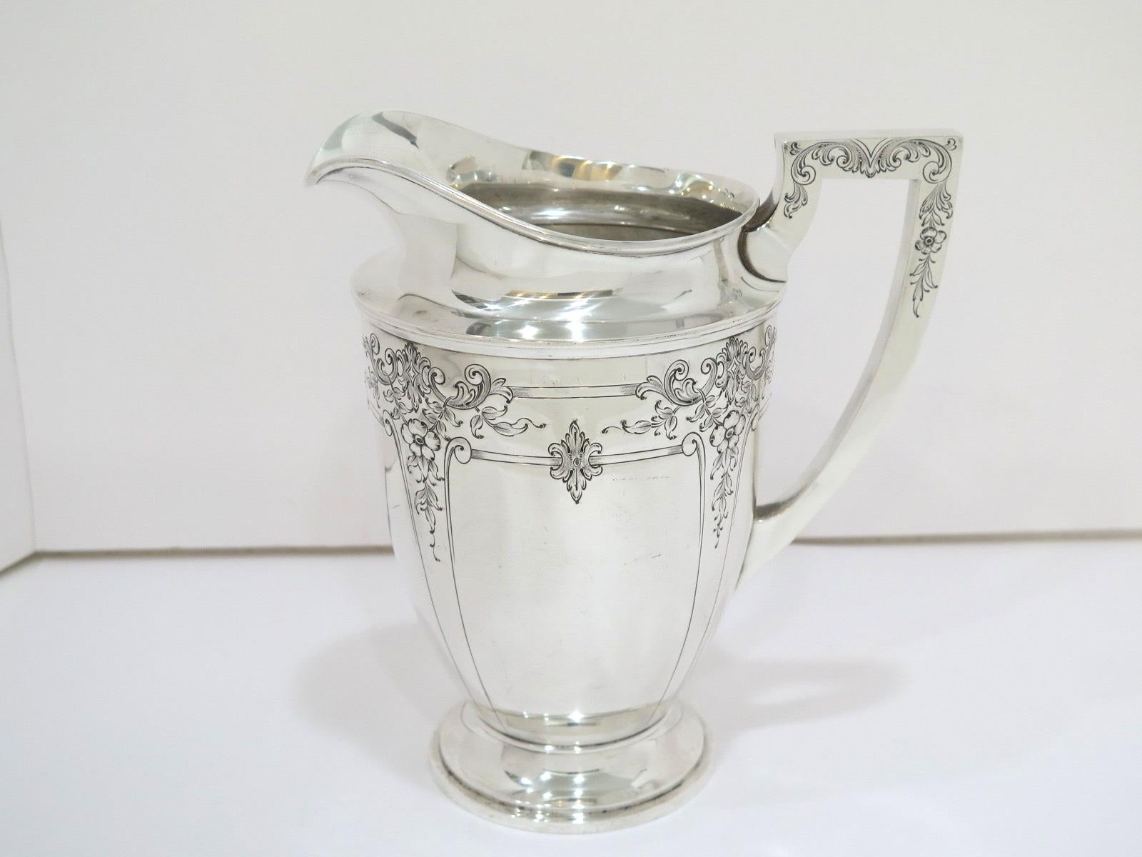 8.75 in - Sterling Silver International Sterling Antique Floral Pitcher In Good Condition In Brooklyn, NY