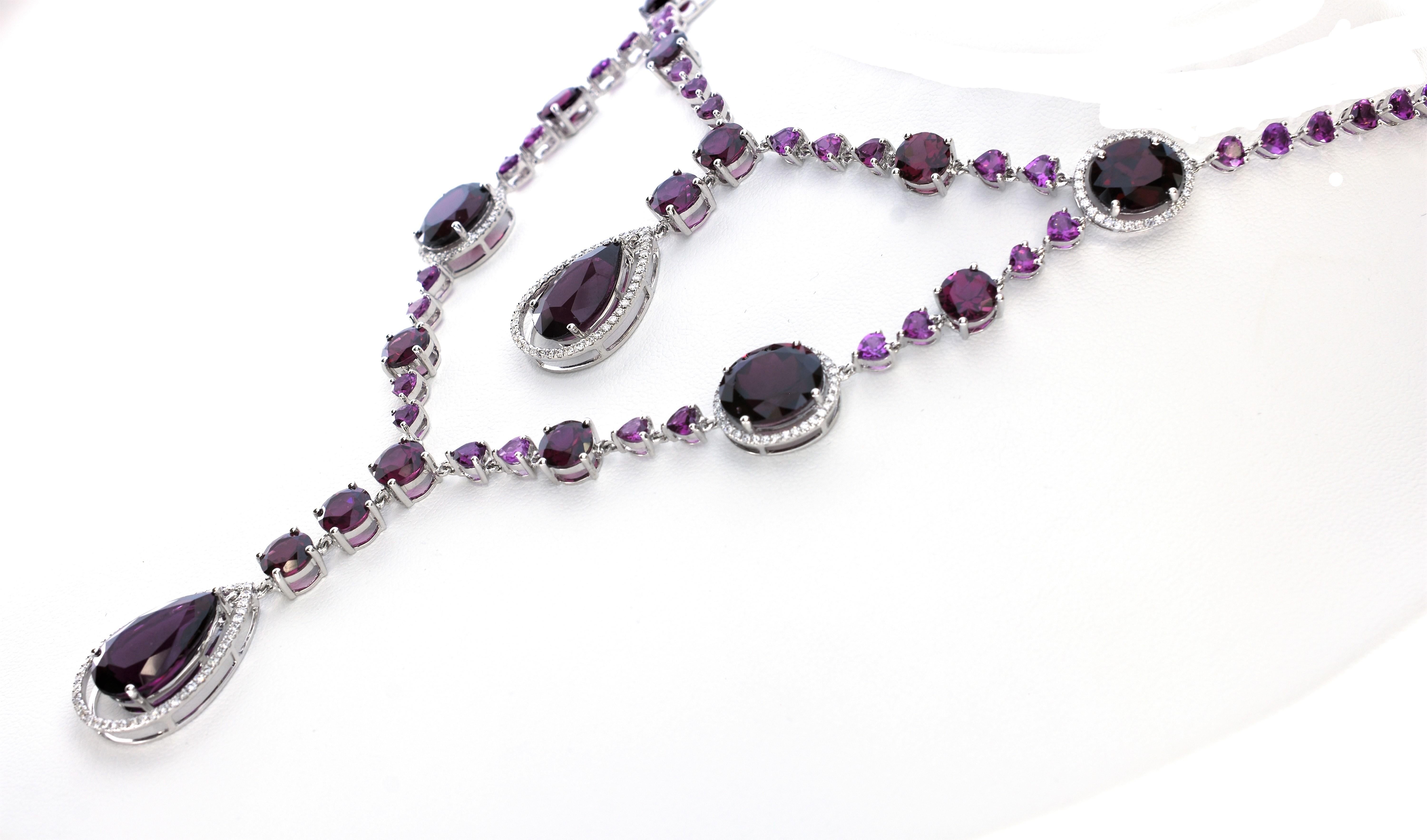 A dazzling array and shades of purple appear from the richness of this beautiful 87.53 Carat purple Rhodolite Garnet And Diamond Necklace. 
This beautiful necklace made by Shimon's Creations is set with 86.03 carats of Purple Rhodolite Garnets,