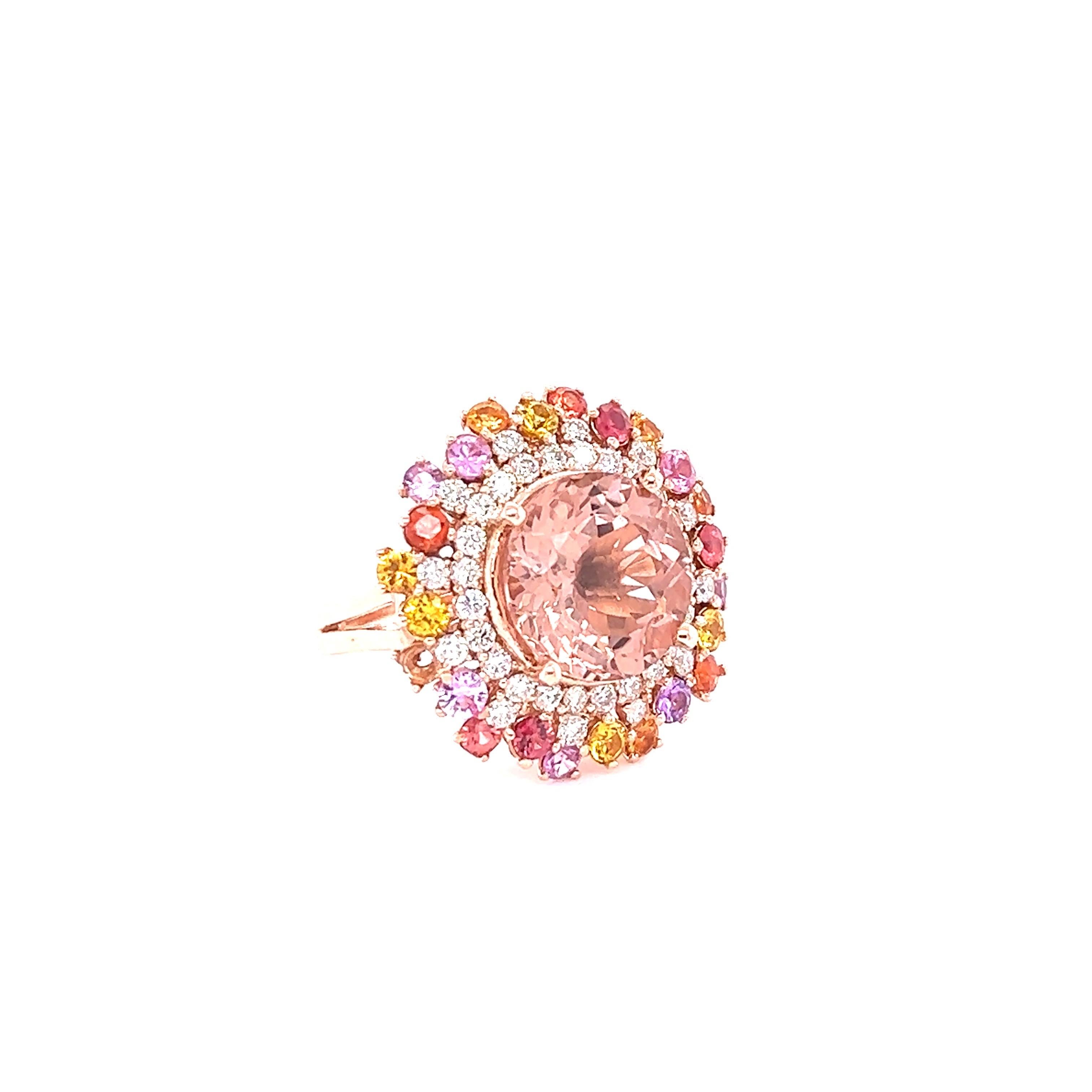 This gorgeous and unique Morganite Sapphire Diamond Ring has a 6.11 Carat Round Cut Morganite which is surrounded by Multicolor Sapphires that weigh 1.82 Carats. It is further accented with 36 Round Cut Diamonds that weigh 0.83 Carats (Clarity: VS,