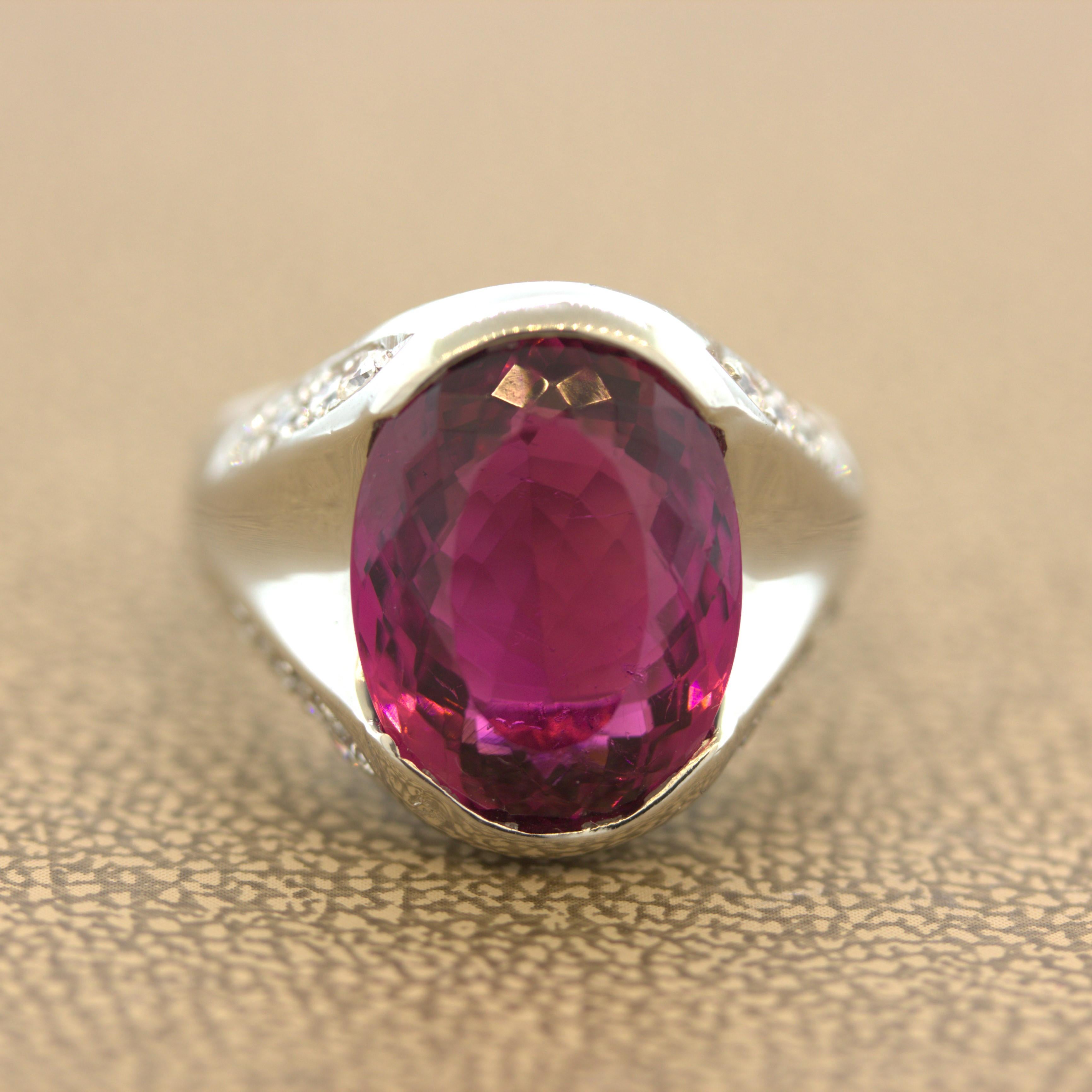 A fine brilliant pink-purple raspberry colored tourmaline takes center stage! It weighs an impressive 8.76 carats and has a bright and brilliant color that is simply sweet and juicy. It is complemented by 0.83 carats of round brilliant-cut diamonds