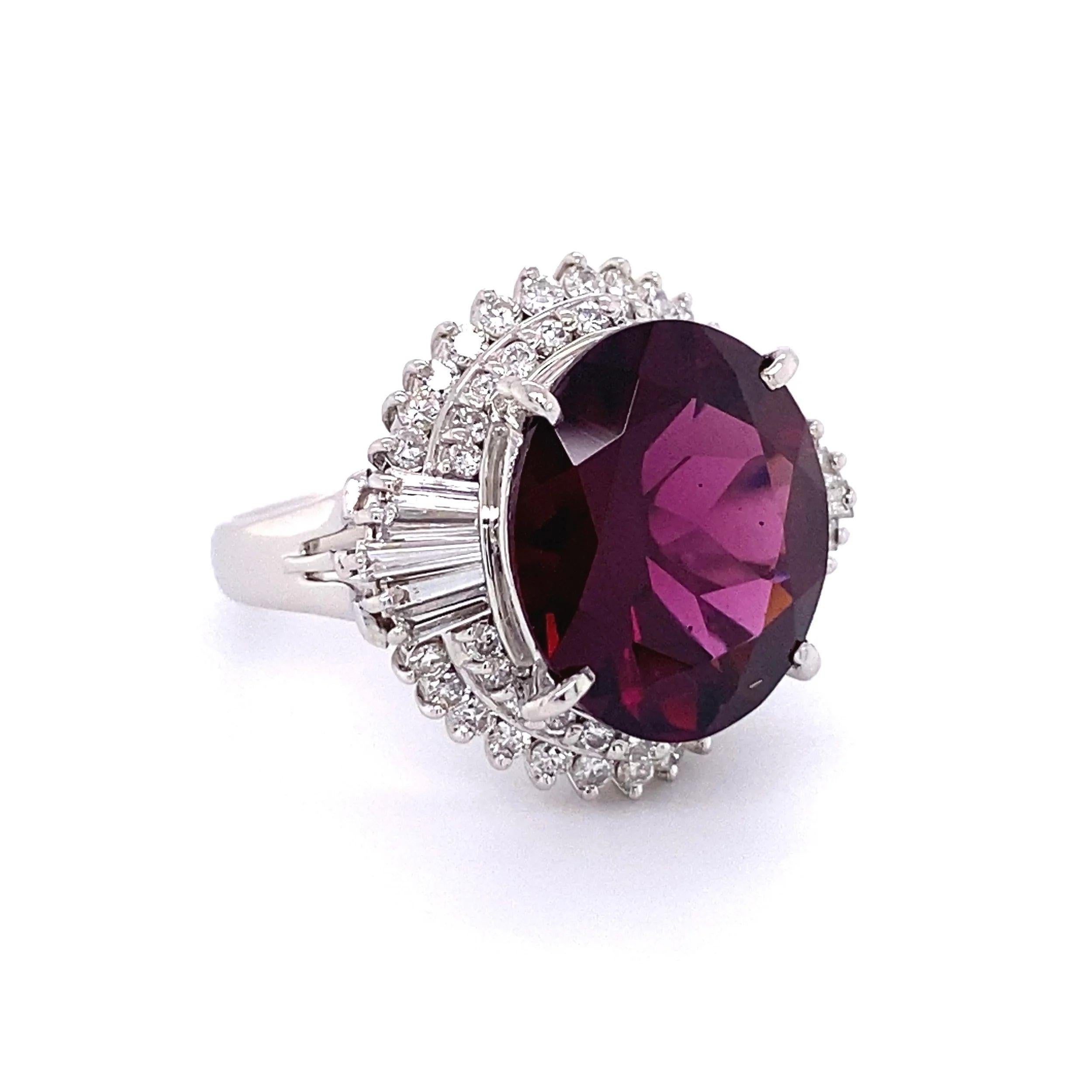 Simply Beautiful! Finely detailed Rhodolite Garnet and Diamond Platinum Vintage Cocktail Ring. Centering a securely nestled Hand set Rhodolite Garnet, weighing approx. 8.76 Carat and surrounded by Diamonds, weighing approx. 0.95tcw. Ring measuring