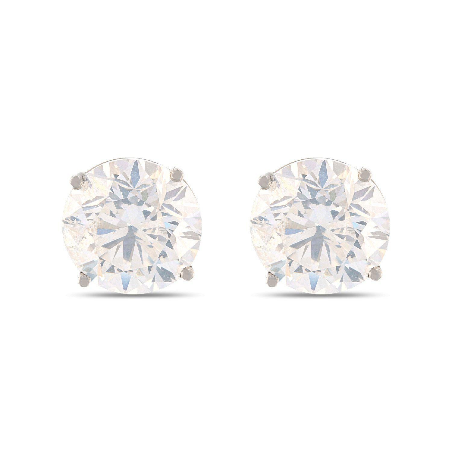 One pair electronically tested platinum ladies cast & assembled diamond solitaire earrings with screw backs. Identified with markings of 