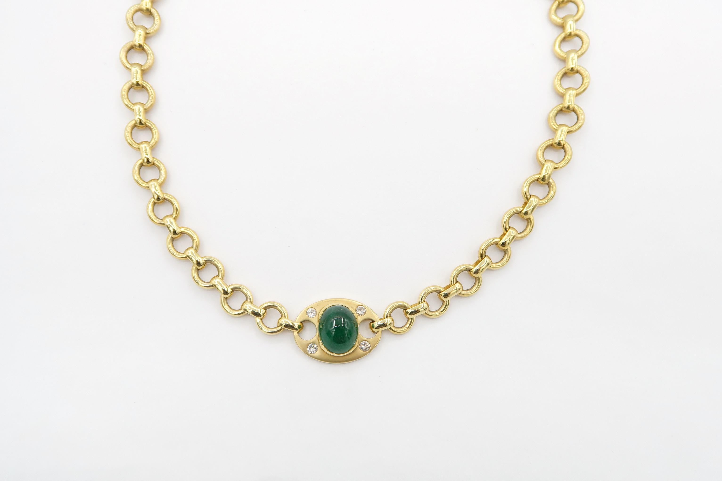 This necklace features 8.79 ct vivid cabochon emerald semi-bezel set in a matte oval 18K yellow gold tag embellished with diamonds. The shiny 18K yellow gold chain is made of 8mm circle round cable links alternating with flat oval links. The