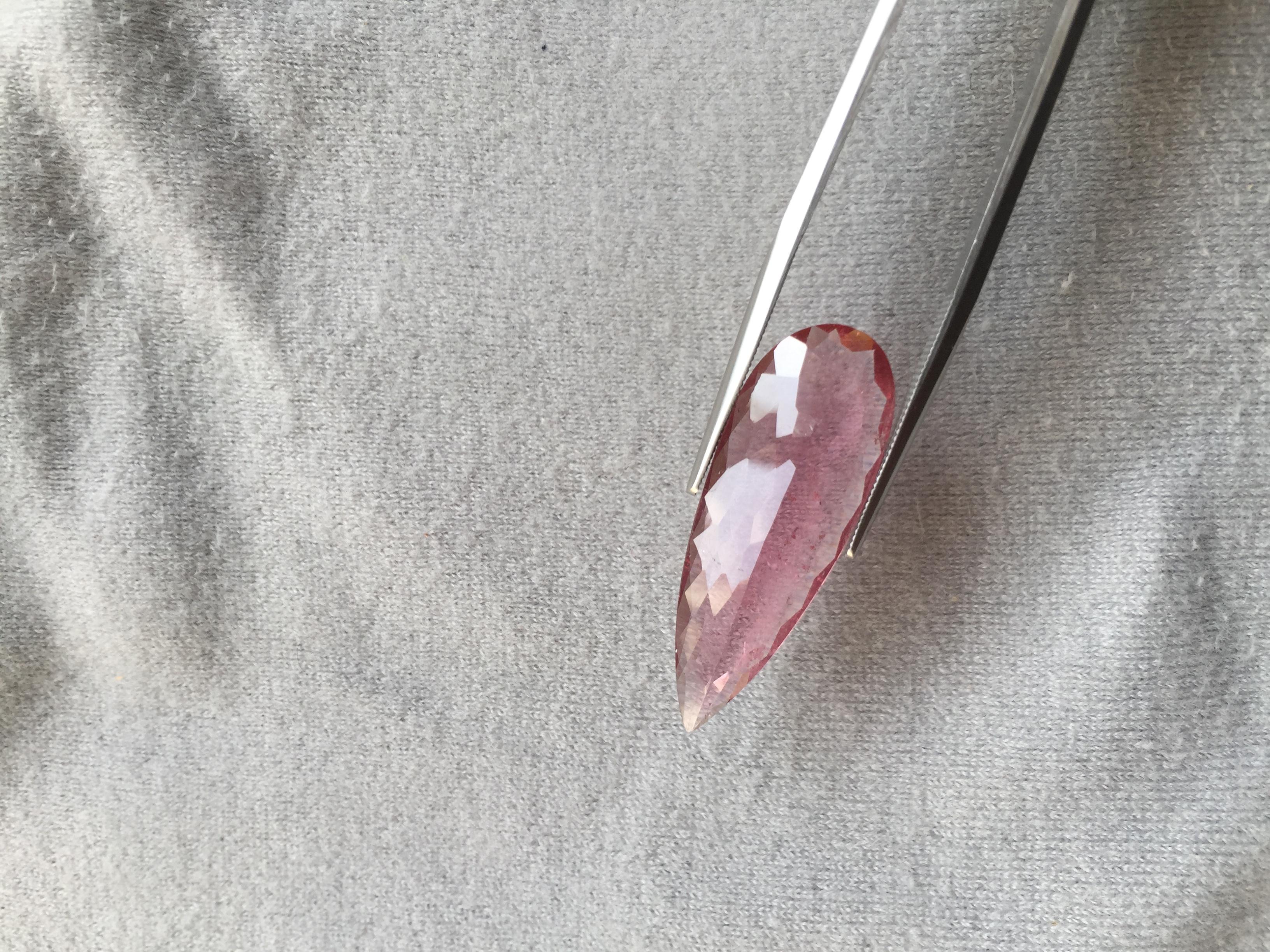 Introducing our 8.79 Carat Pink Tourmaline Pear Cut, the perfect gemstone for high-end jewelry. Crafted from high-quality tourmaline, this stunning gemstone features a gorgeous pink hue that is both elegant and sophisticated. The elongated pear cut