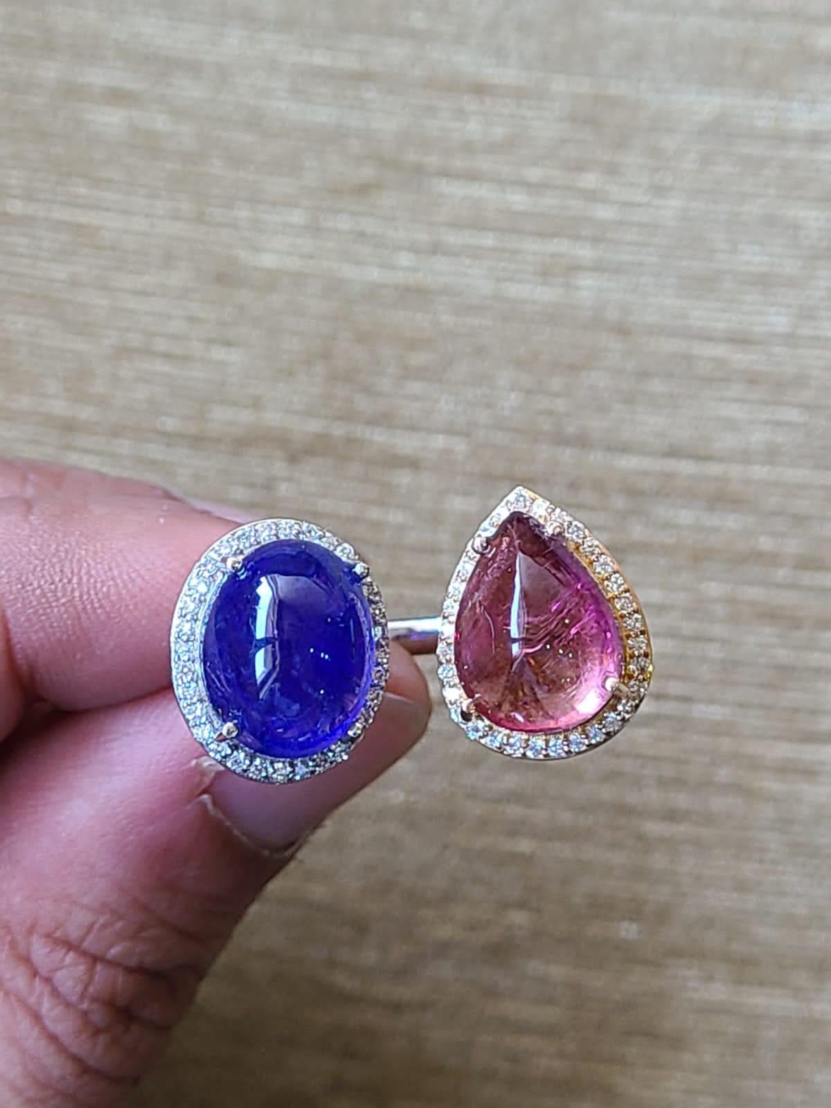 A very special and one of a kind, Tanzanite & Rubellite Cocktail Ring/ Dome Ring set in 18K Gold & Diamonds. The weight of the Tanzanite cabochon is 8.79 carats. The Tanzanite is ethically sourced from Tanzania. The weight of the Rubellite is 6.38