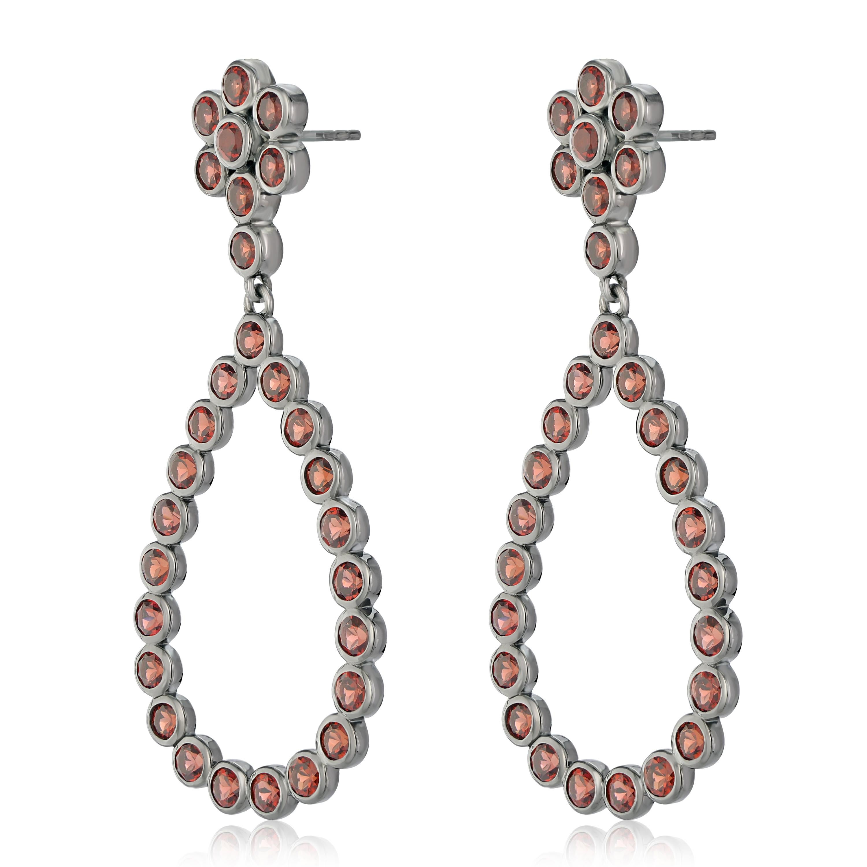 Known to be the birthstone for the month of January, garnets symbolize friendship and trust. These women's earrings feature 3 mm garnets 8.7 Ct  arranged in a floral and open teardrop design. These earrings are crafted in genuine and nickel free