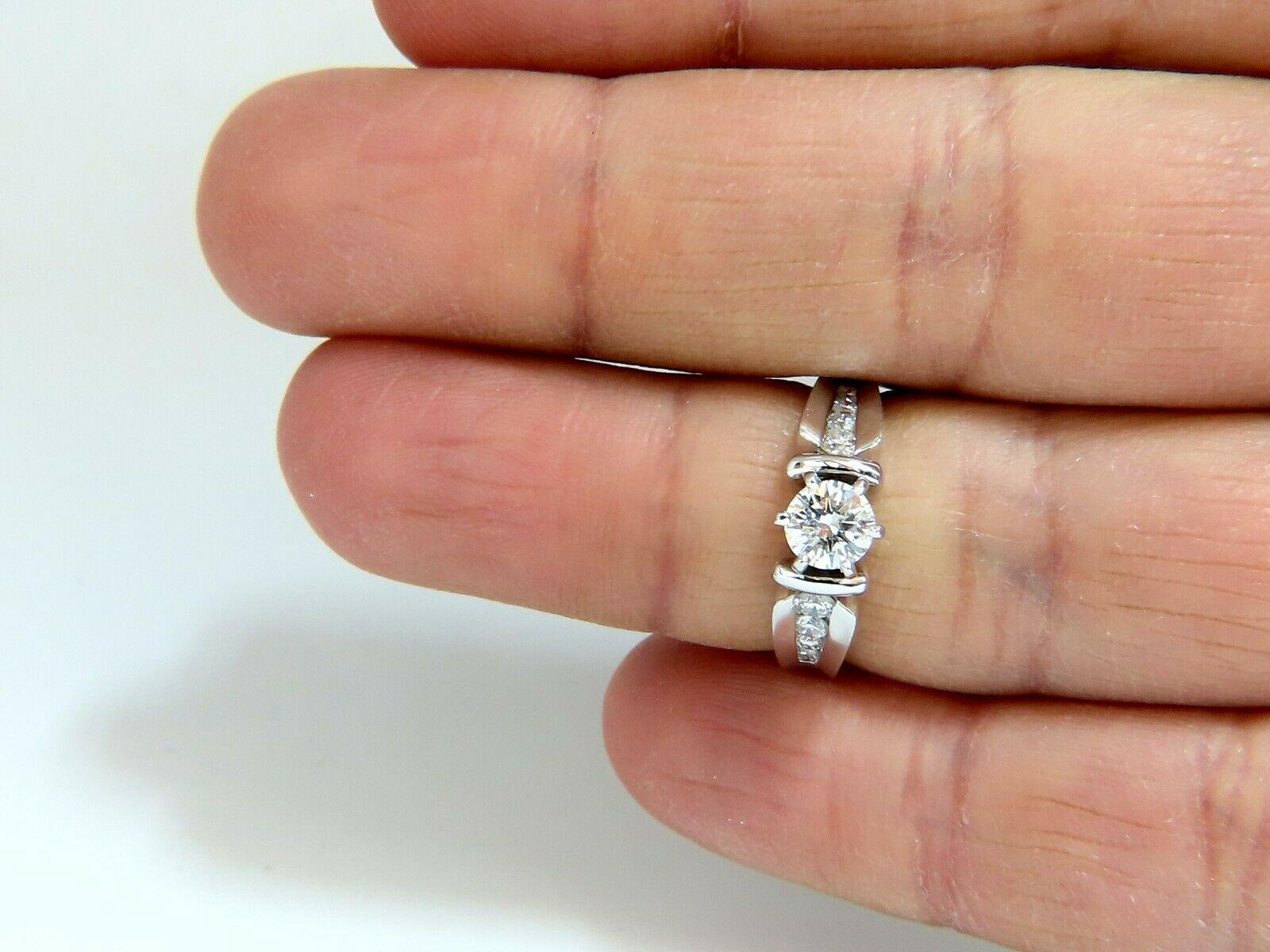 Traditional Engagement ring.

.47ct. round natural diamond

5.2mm diameter. 

I-color Si-1 clarity.

Side Diamonds: .40ct.

I -color Si-1 clarity.

14kt white gold 

5 grams.

current ring size: 6.5

We may resize, please inquire.

$6,700 Appraisal