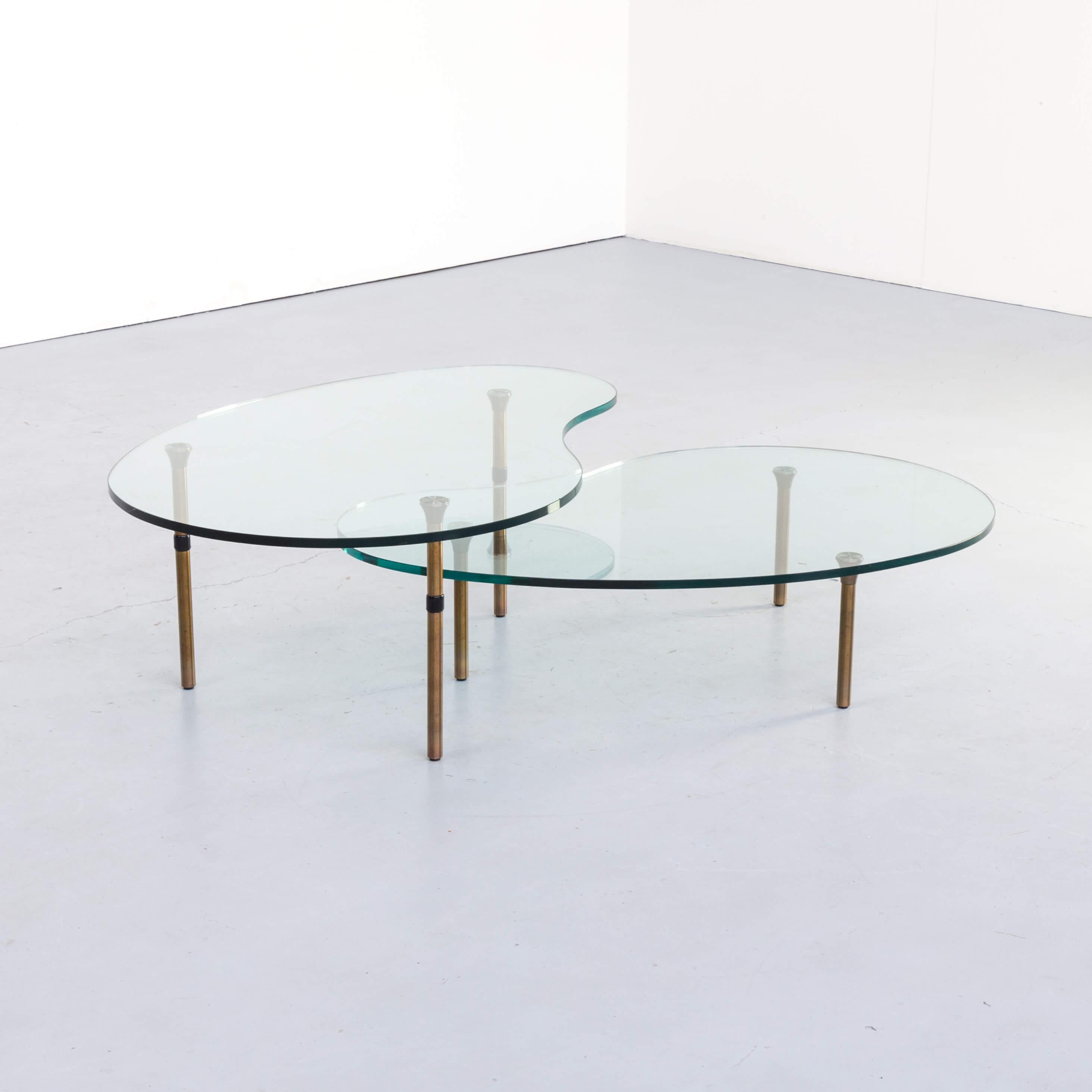 Since 1981 Enzo Mari has been working with Zanotta. The ambo coffee tables are made of glass and brushed steel, which was a fully new technique in 1987 when Mari designed the ambo series ‘glueing’ the feet at the glass tabletop. This set is in good
