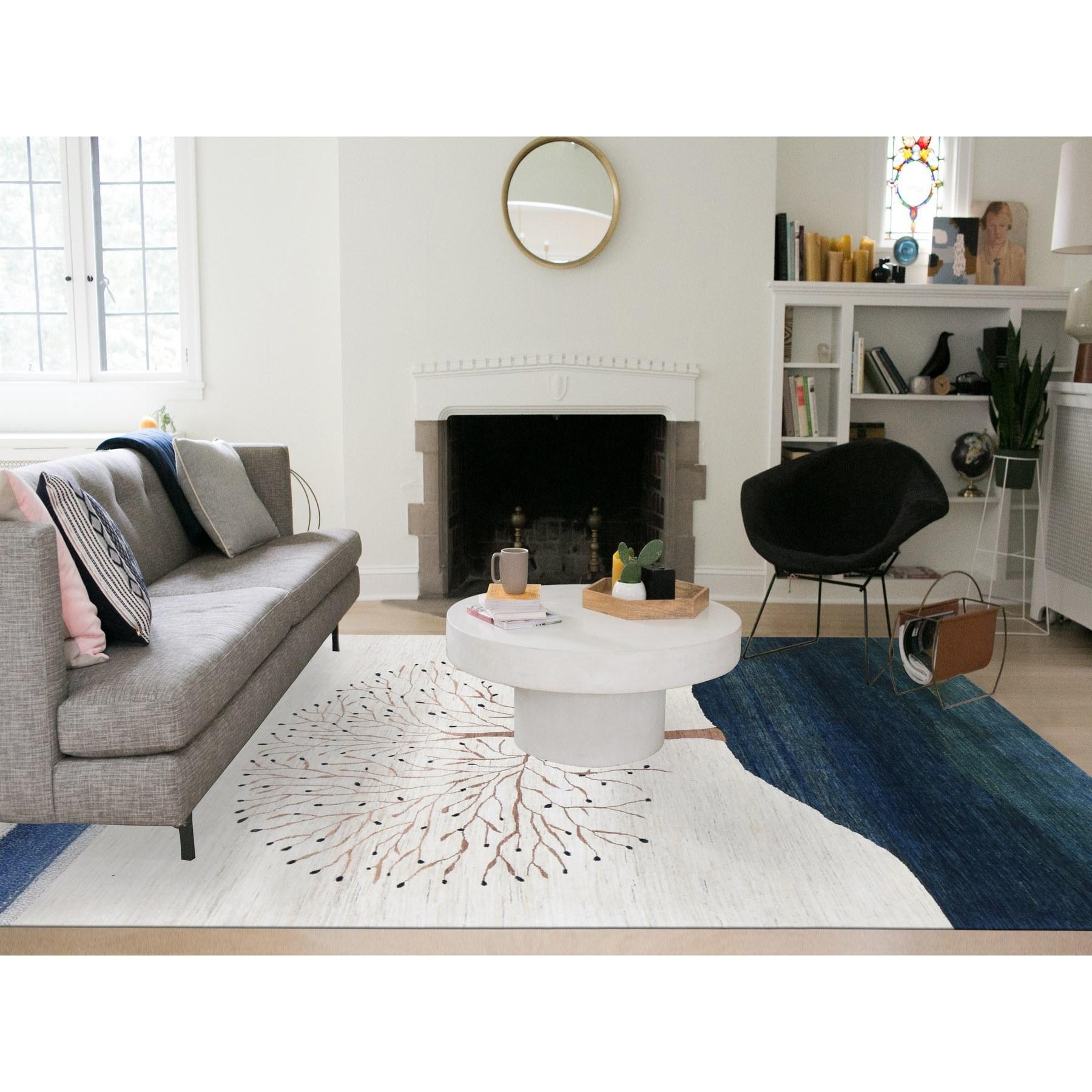 Ivory, Modern, Thick, Soft and Plush Persian Wool Gabbeh with Large Tree Design, Hand Knotted, Oriental Rug
Primary materials: Wool
Latex: No Pile 
height: 0.25 Inches
Style: Transitional
Primary color: Ivory
Secondary colors: Brown, Blue,