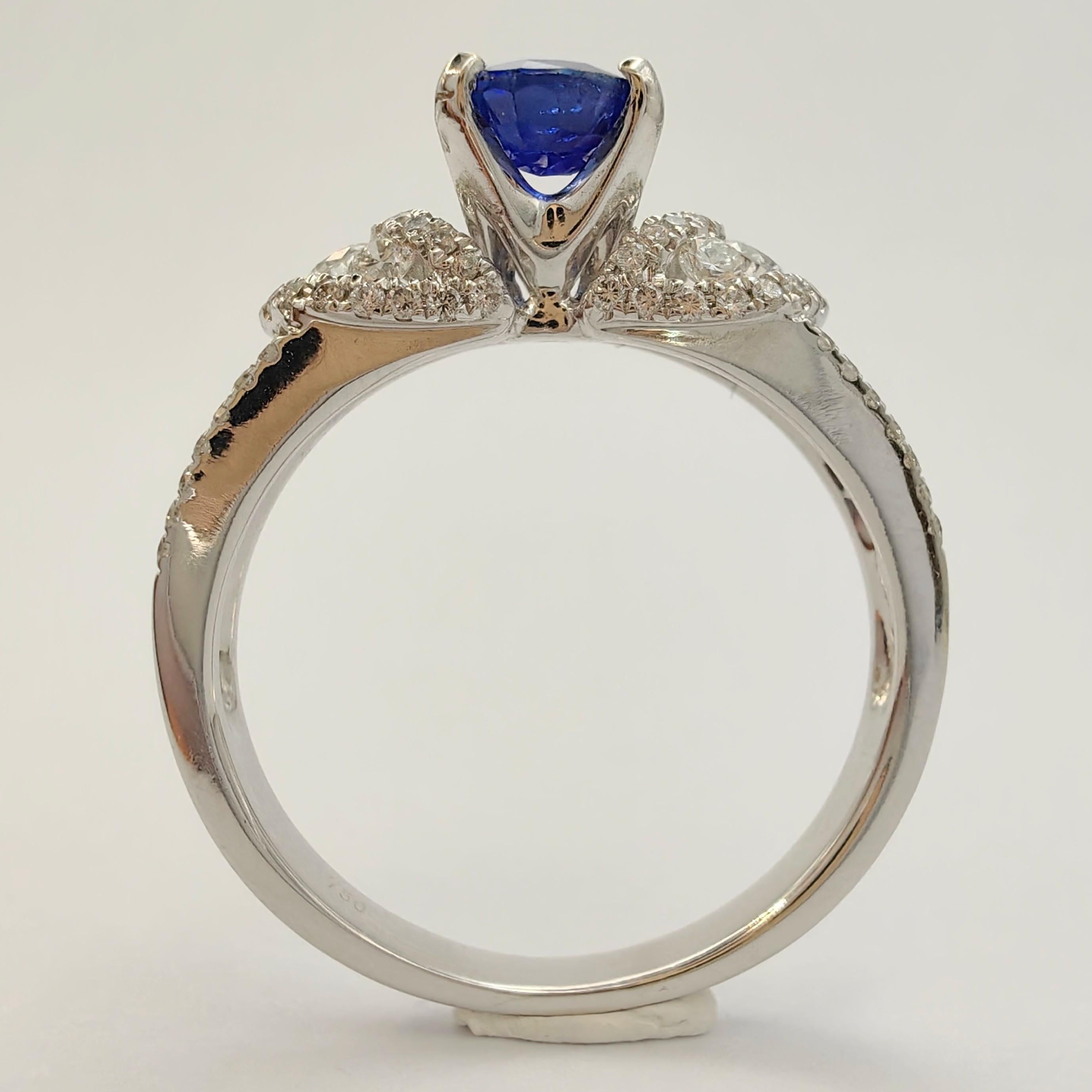 Oval Cut .88 Carat Oval-Cut Sapphire 88 Diamond Cluster Ring in 18k White Gold For Sale