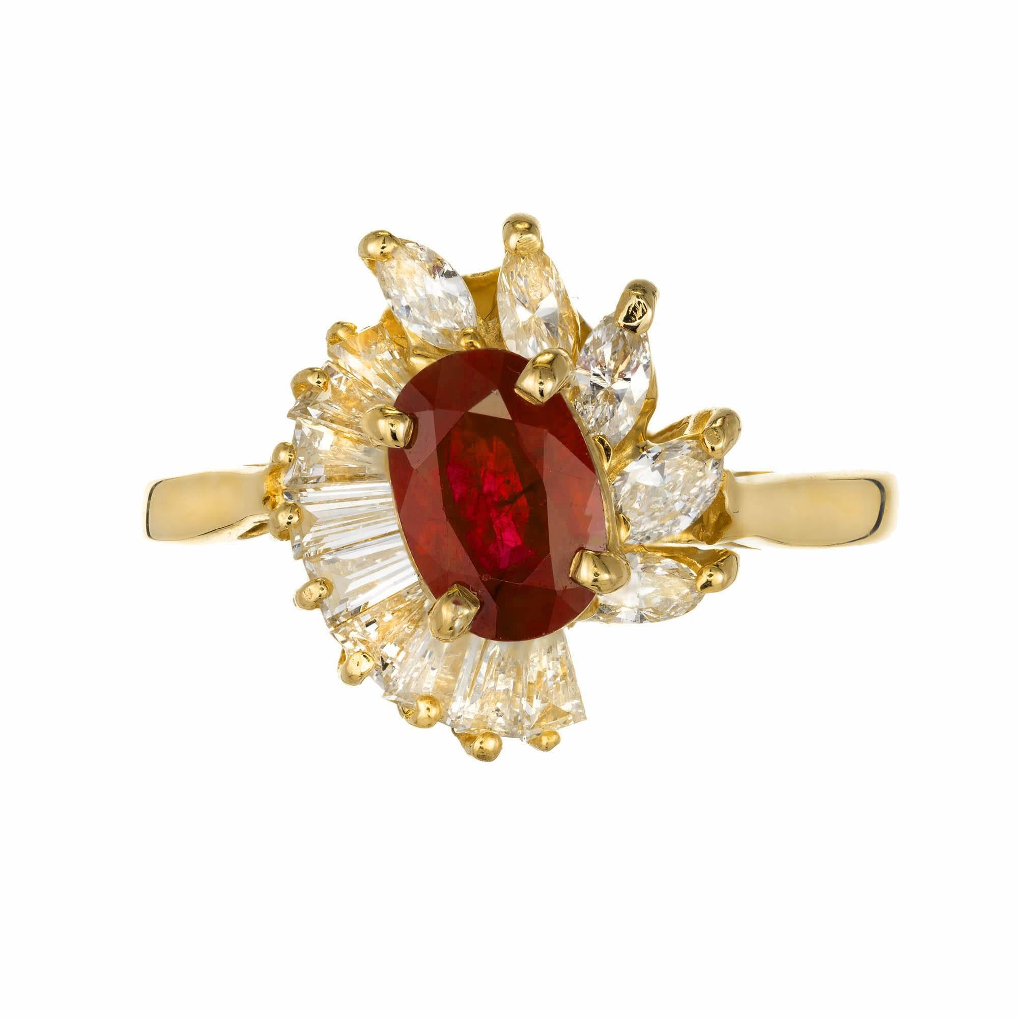 14k yellow gold Ruby and diamond engagement ring. Oval ruby set in a cluster style ring. Cluster is made of tapered baguette diamonds on one side and marquise diamonds on the opposite side.

1 oval ruby 7.18x 4.9 x 3.33 Approximate .88 carats
9