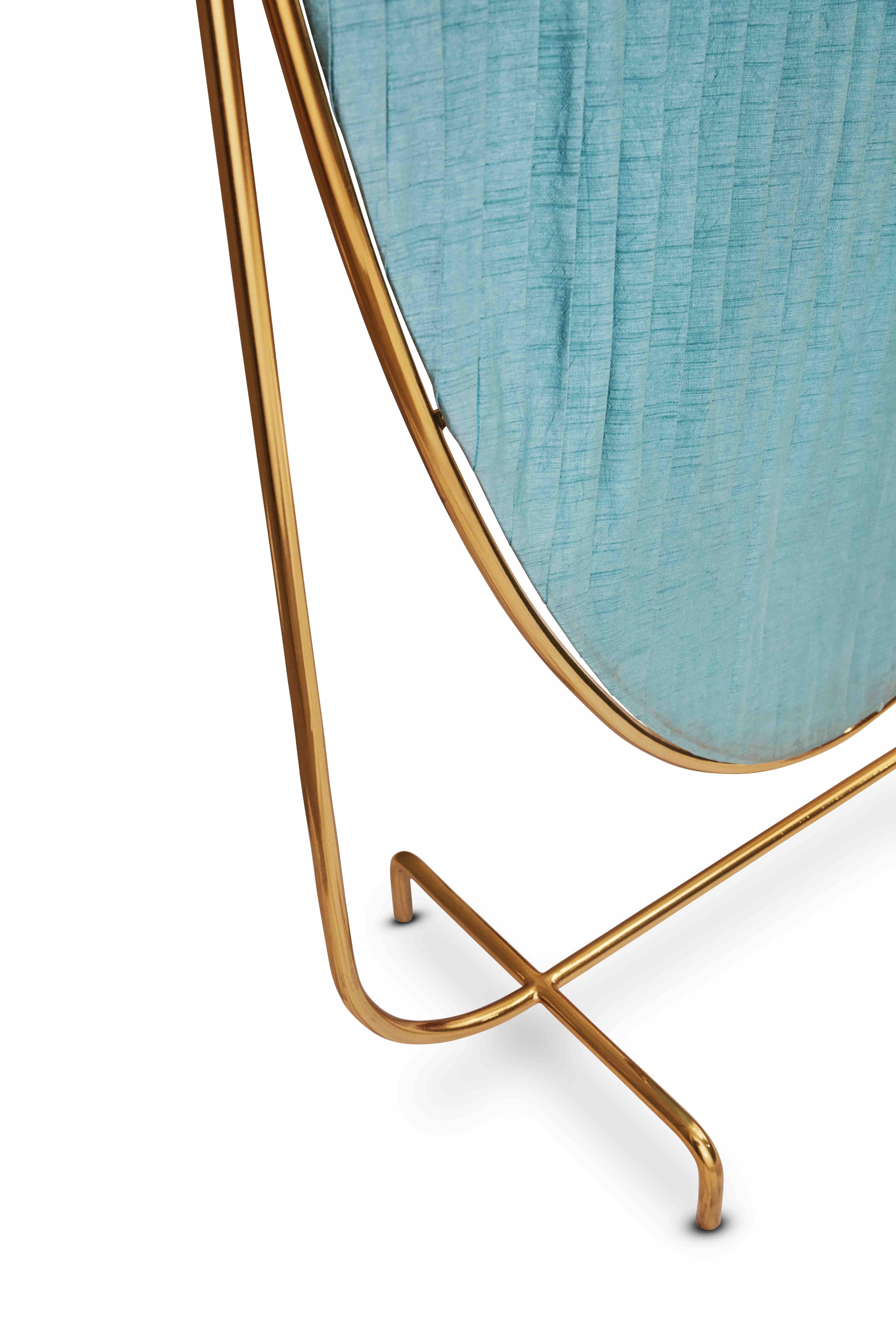 88 Secrets Screen in gold metal and blue silk by Nika Zupanc has a metal frame with meticulously pleated blue silk fabric. 

Nika Zupanc, a strikingly renowned Slovenian designer, never shies away from redefining the status quo of design, moving
