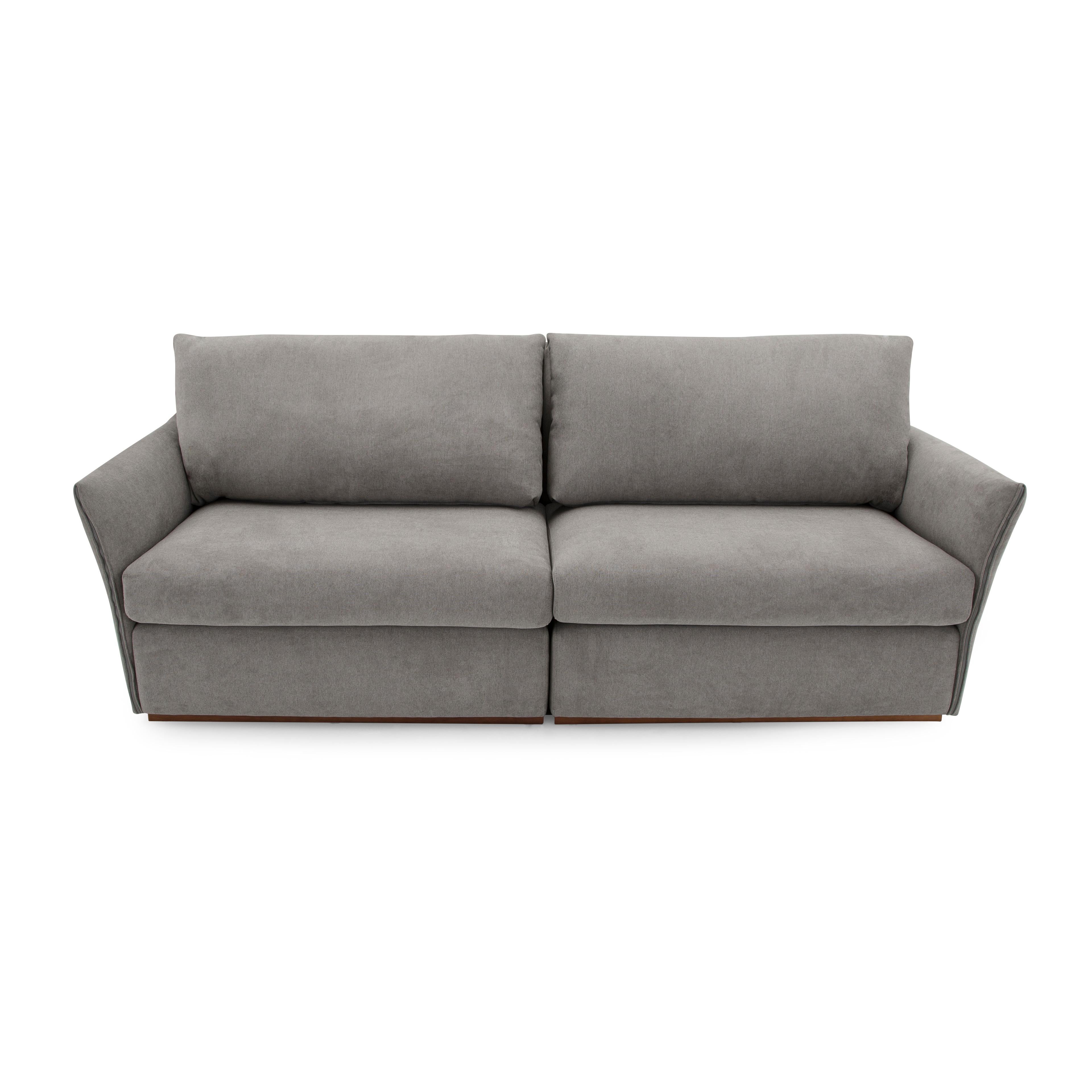 The Thin sofa with bowed arms, upholstered in a gray fabric is here for you and your family. As relaxing as it looks, the actual seat is even better. Complete with padded arms, this sofa is the perfect complement to a room used by the entire family