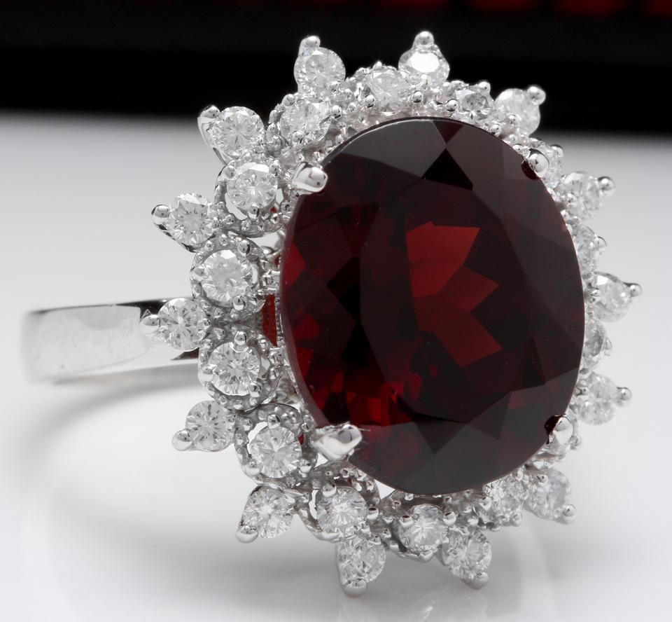 8.80 Carats Natural Impressive Red Garnet and Diamond 14K White Gold Ring

Total Natural Red Garnet Weight is: Approx 8.00 Carats

Red Garnet Measures: Approx. 13.00 x 10.91mm

Natural Round Diamonds Weight: Approx. 0.80 Carats (color G-H / Clarity