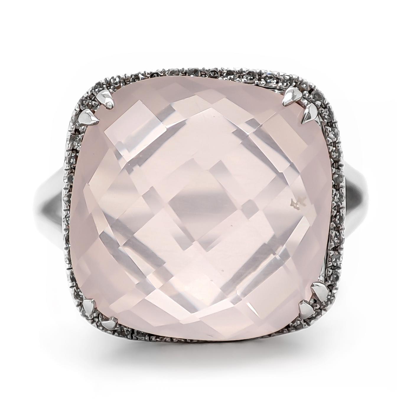 FOR US BUYER NO VAT

This beautiful piece features a 8.68 carat pink quartz as its centerpiece, adding a captivating burst of color to its design.

Enhancing the allure of the quartz are 52 diamonds, totaling 0.12 carats. These diamonds exhibit a