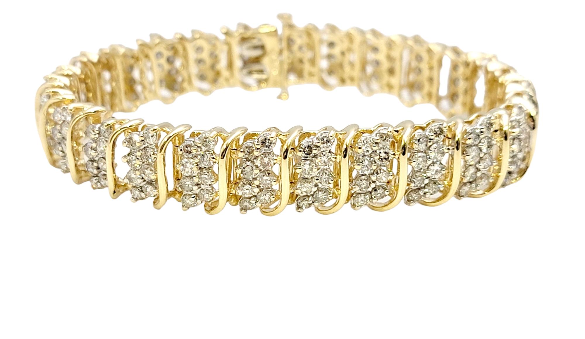Absolutely dazzling modern tennis bracelet filled from end to end with 8.81 carats of bright sparkling natural diamonds. The flexible 'S' links hug the wrist for a comfortable and secure fit, while the gentle movement allows for massive sparkle from