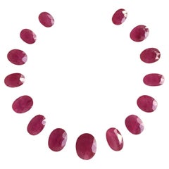 88.13 Carats Ruby Mozambique Oval Faceted Cut stone Layout Heated Natural Gem