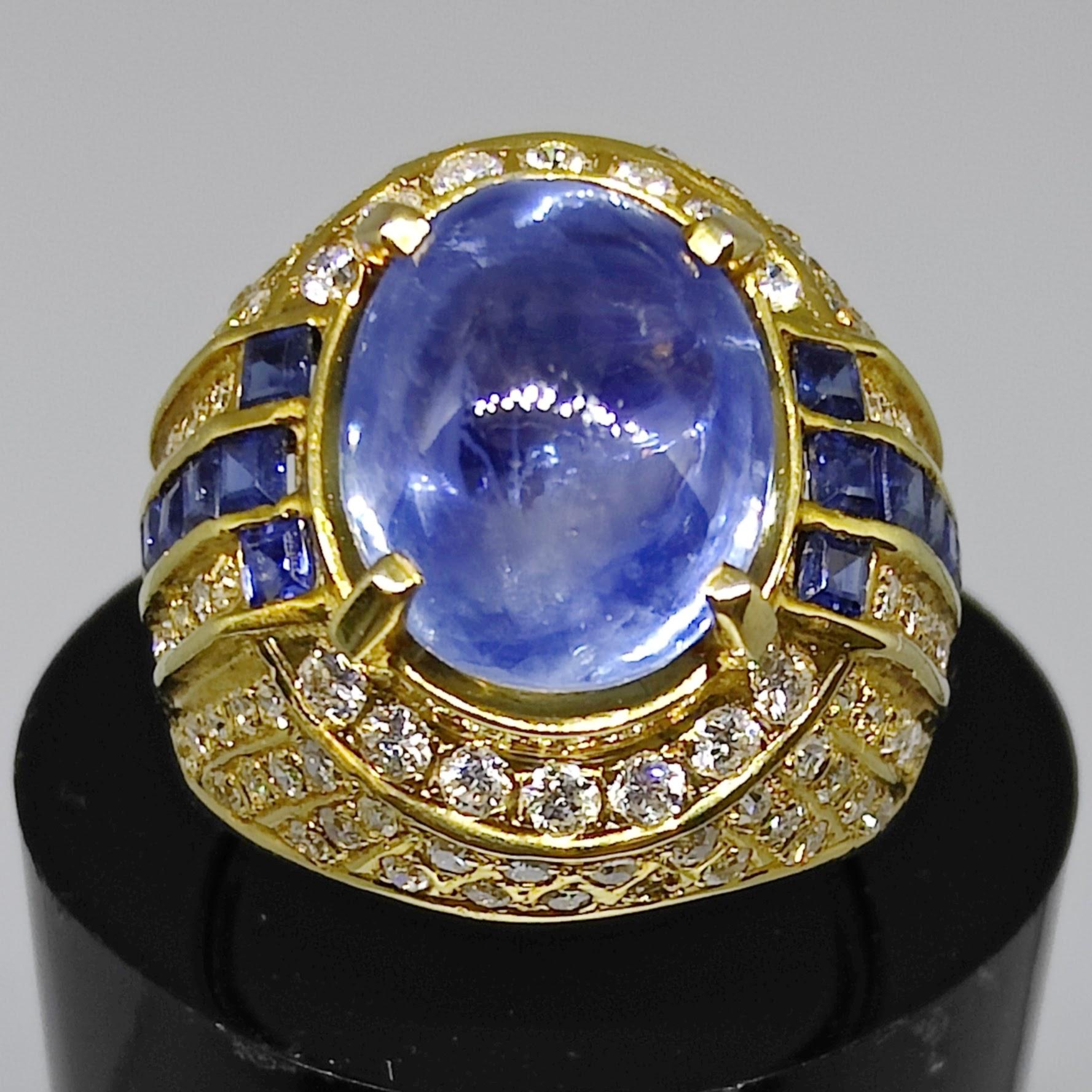 Introducing our Vintage Art Deco 8.82ct Cabochon Blue Sapphire Diamond Men's Ring in Yellow Gold, a true testament to timeless elegance and sophistication. This magnificent ring exudes vintage charm, drawing inspiration from Egyptian art and Art