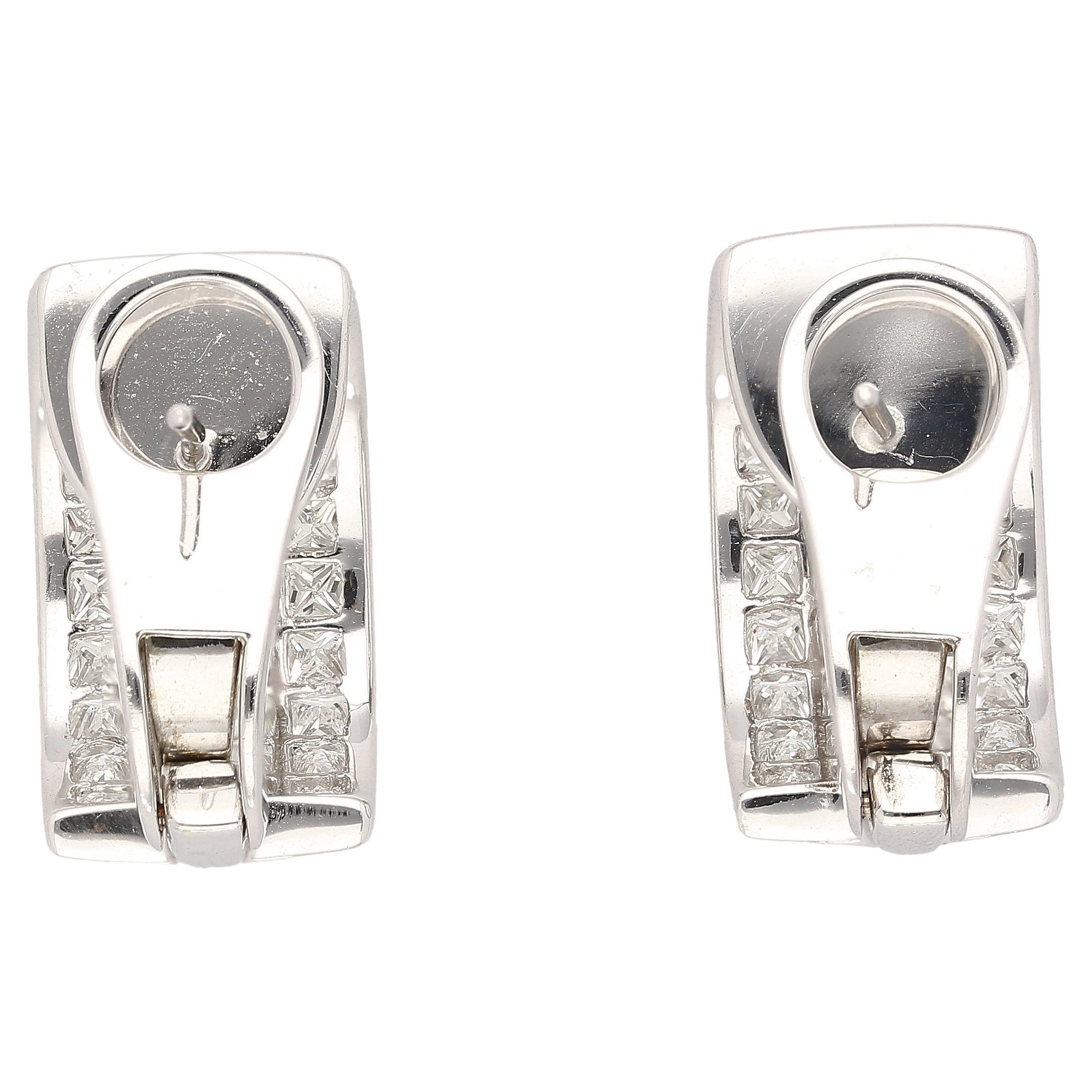 Indulge in the timeless allure of these meticulously designed earrings, adorned with a total carat weight of 8.82 CTW Natural Diamonds. Each diamond is carefully selected for its exceptional quality and brilliance, ensuring a breathtaking sparkle
