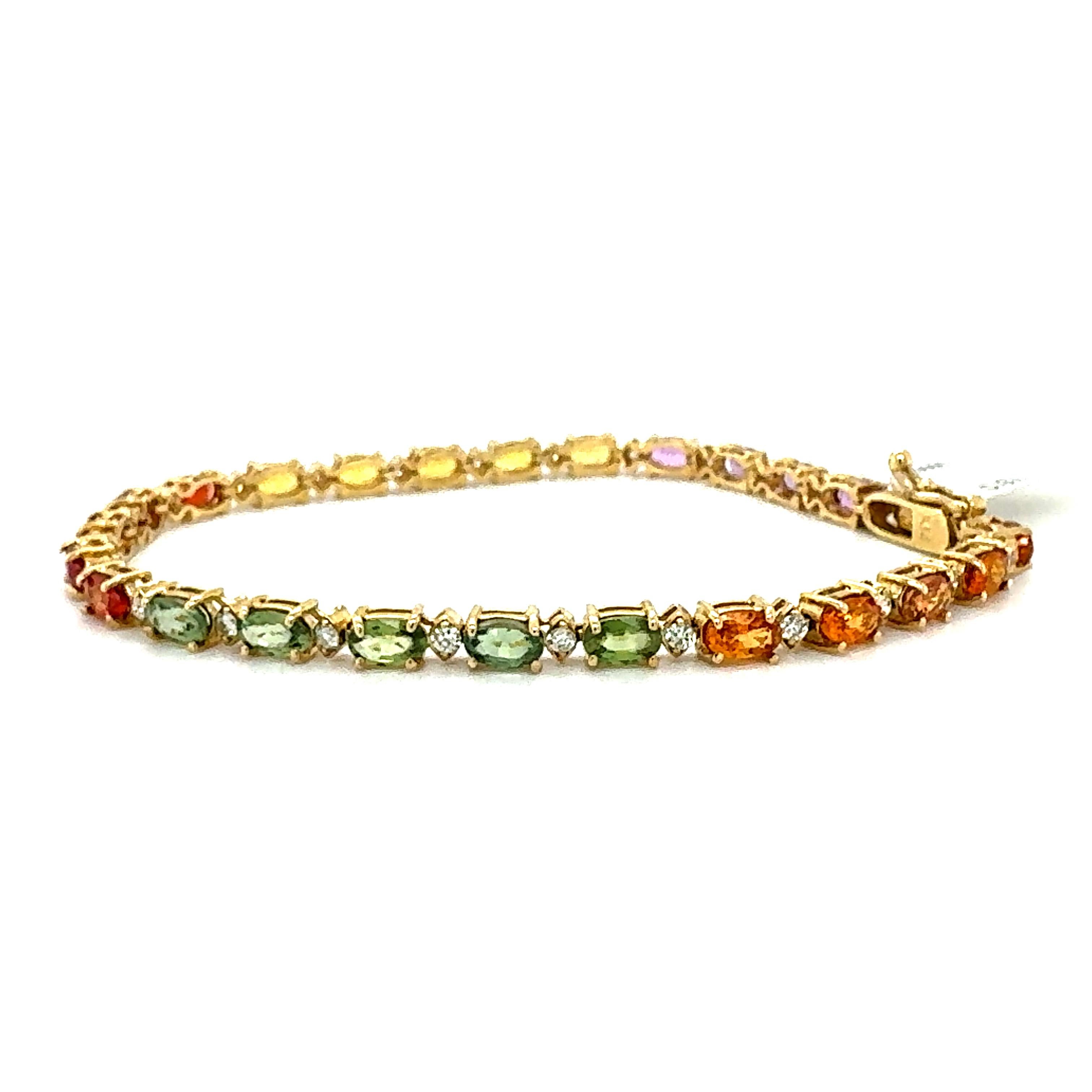 Beautifully designed 8.83 Carat Multi-Color Sapphire and Diamond Yellow Gold Tennis Bracelet.  This gorgeous piece has 25 Oval Cut Multi-Color Sapphires that weigh 8.19 Carats and 25 Round Cut Diamonds that weigh 0.64 carats The clarity and color of