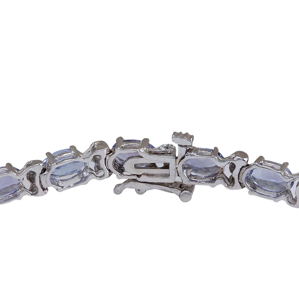 Stamped: 18K White Gold
Total Bracelet Weight: 8.1 Grams
Bracelet Length: 7.0 Inches
Bracelet Width: 4.65 mm
Gemstone Weight: Total Natural Tanzanite Weight is 8.74 Carat (Measures: 4.15x6.00 mm)
Color: Blue
Diamond Weight: Total Natural Diamond