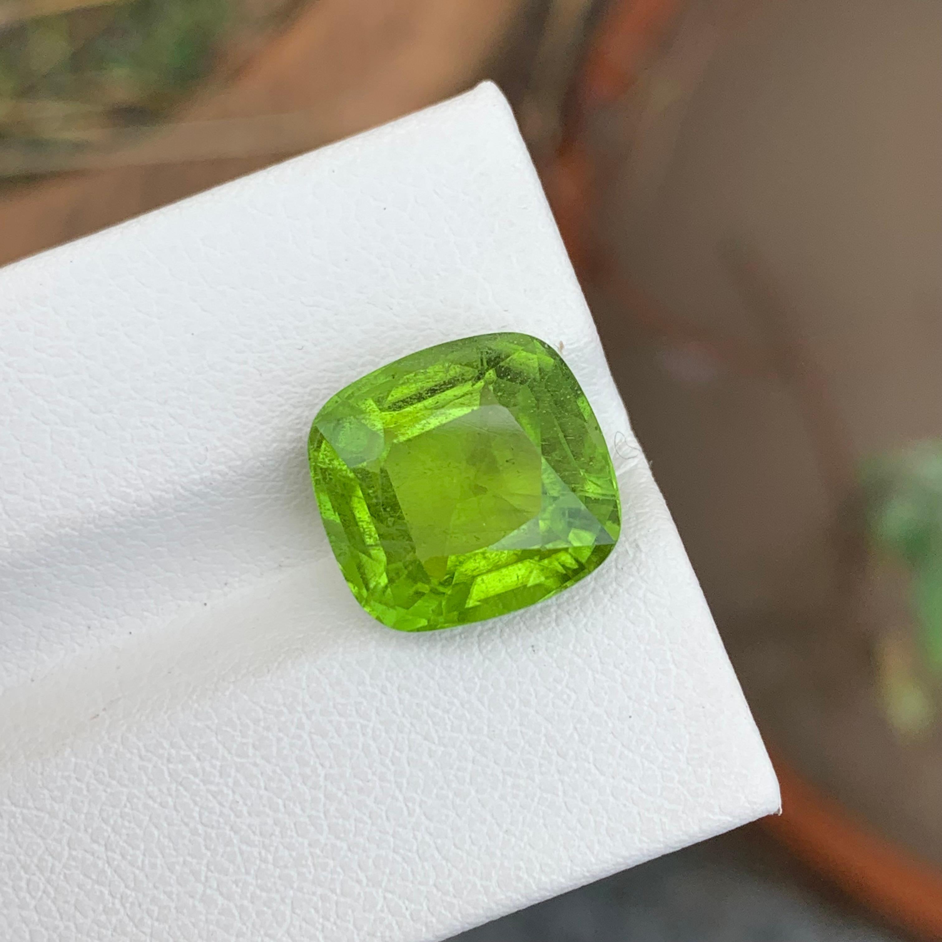 Loose Peridot
Weight: 8.85 Carats
Dimension: 12.3 x 11.7 x 7.7 Mm
Colour: Green
Origin: Supat Valley, Pakistan
Shape: Cushion 
Certificate: On Demand
Treatment: Non

Peridot, a vibrant and lustrous gemstone, has been cherished for centuries for its