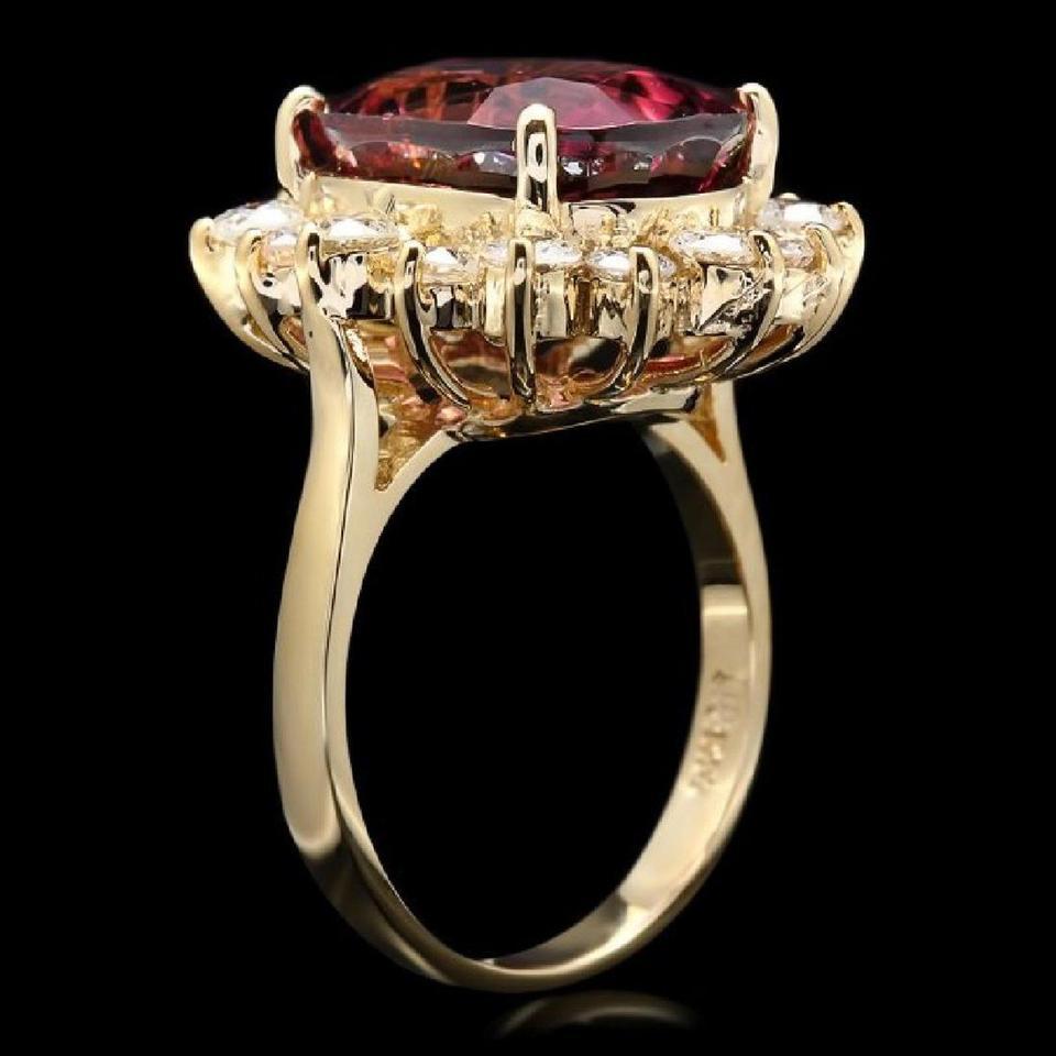 8.85 Carats Natural Very Nice Looking Tourmaline and Diamond 14K Solid Yellow Gold Ring

Total Natural Oval Cut Tourmaline Weight is: Approx. 7.50 Carats (Treatment-Heat)

Tourmaline Measures: Approx. 13.00 x 10.00mm

Natural Round Diamonds Weight: