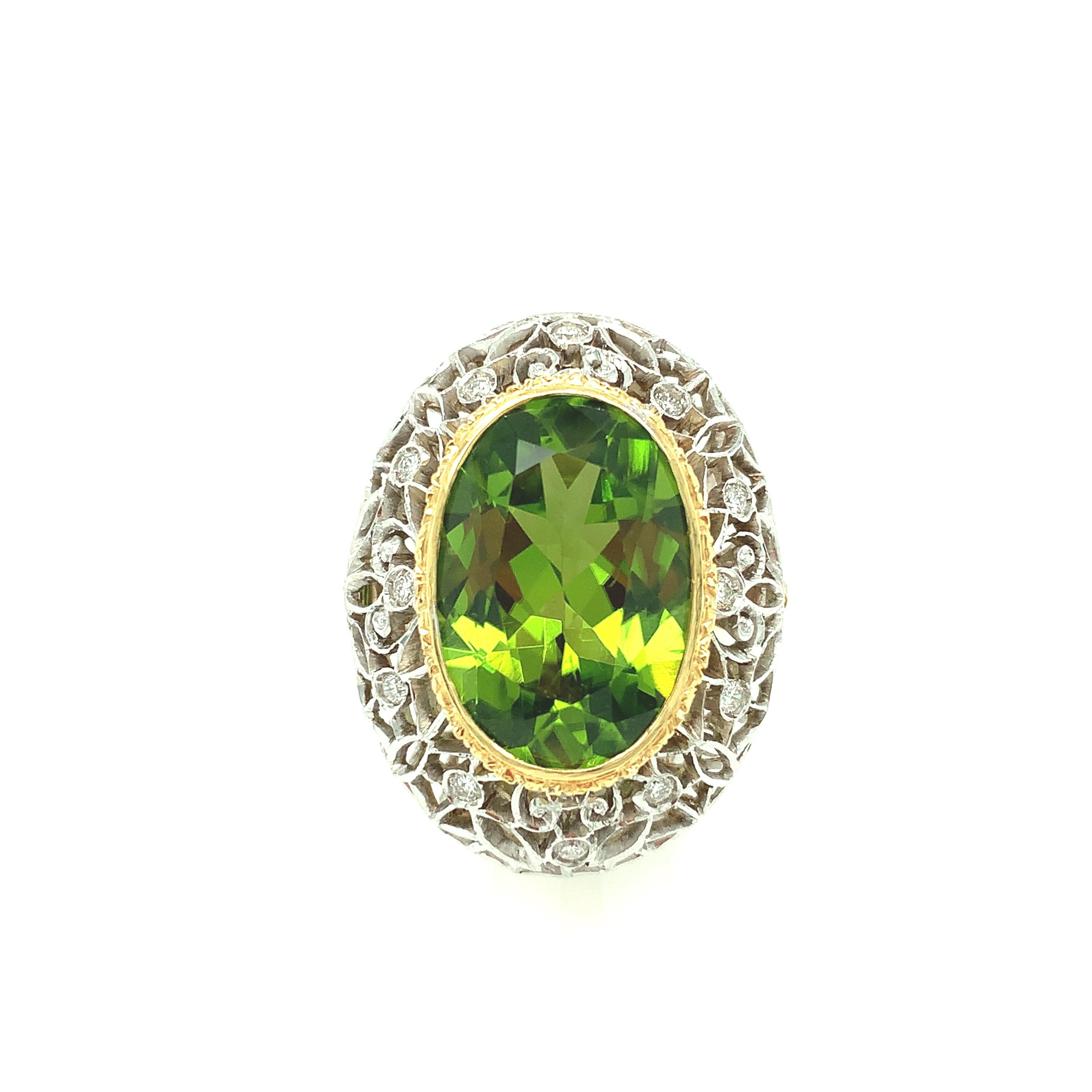 This is a truly beautiful ring, from the size and quality of peridot it features to the exquisite Florentine inspired craftsmanship. The large oval peridot is clear and crystalline, with bright, 
