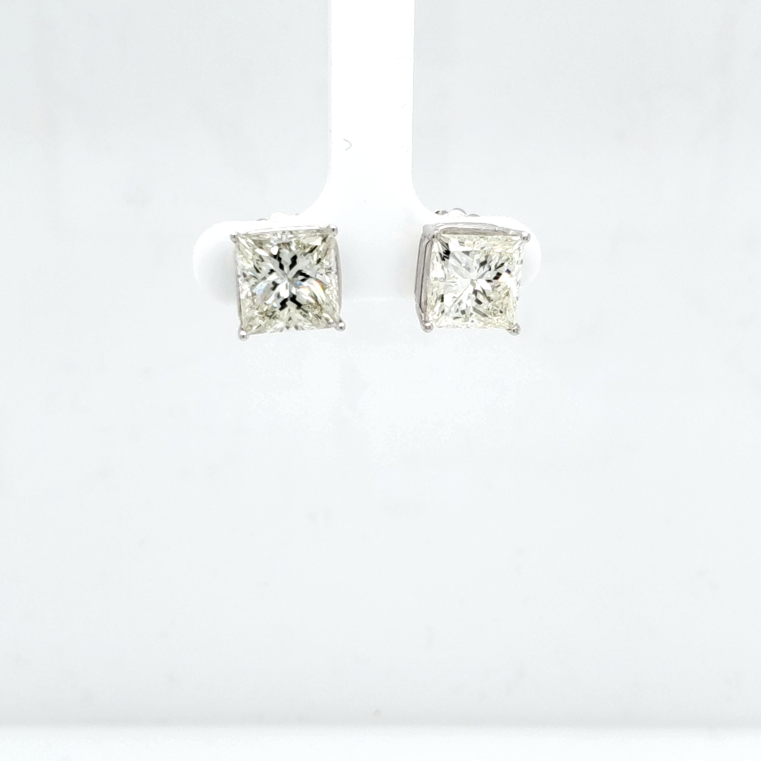 One Diamond weights 4.50 carats and the other weights 4.35 carats, Both are square princess cuts.The Diamonds are about K=L in color and Si1 in clarity. Not GIA certified. Set in 14k 4 prong studs. More shapes and sizes available. 