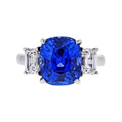 8.86 Carat Cushion Cut Blue Sapphire Three-Stone Diamond Platinum Ring