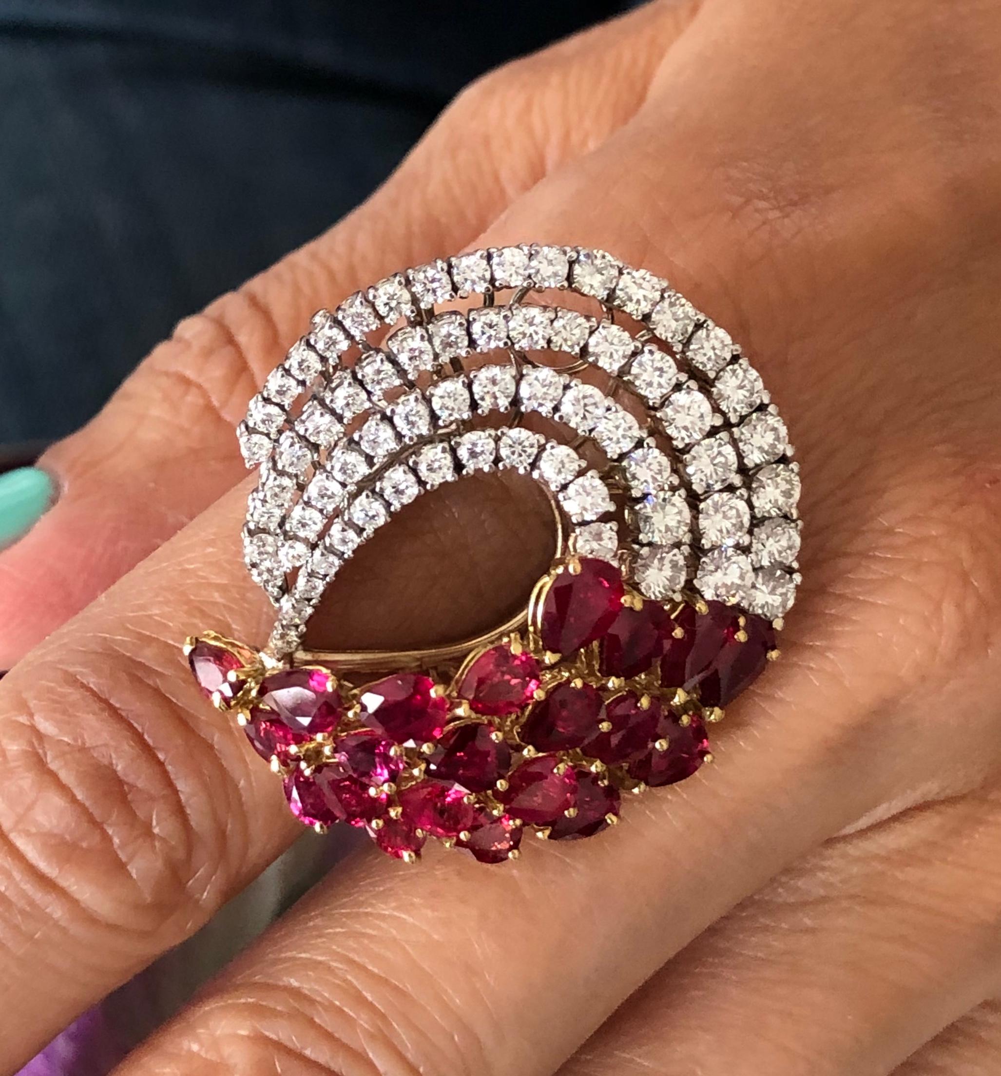 Offered here is a unique Ruby & diamonds ring set in 18kt two ( 2 ) tone gold. The ring measures approximately 1.5” x 1.5” on top and the shank graduates down from 3.60 mm to 2.90 mm. The ring is marked 750 and weighs 16.80 grams with a finger size