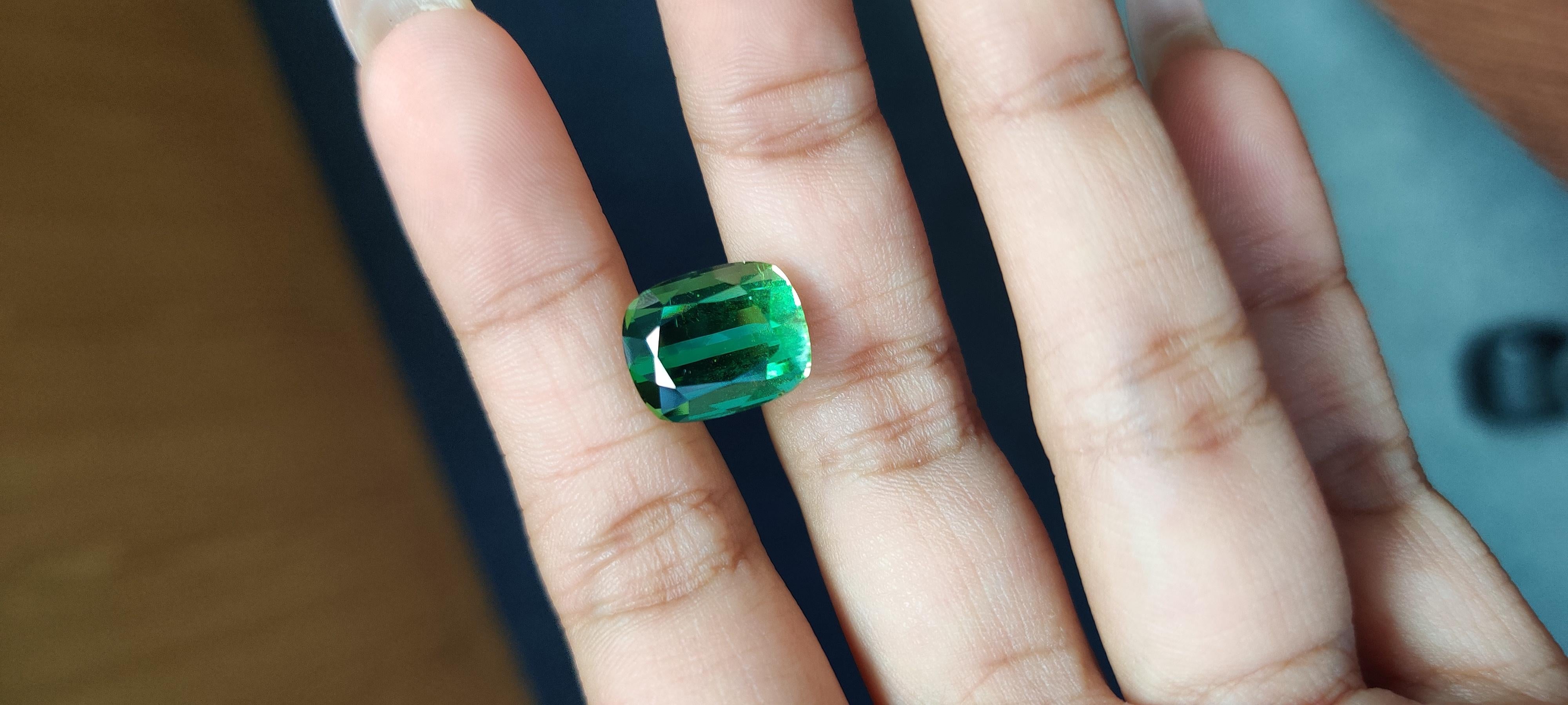 A massive, mesmerizing 8.88 Carat Tourmaline stone that is vivid green in color. It is completely natural and of good quality. The tourmaline piece is cut into perfection in a cushion-cut shape.

The orange tourmaline has not undergone any form of