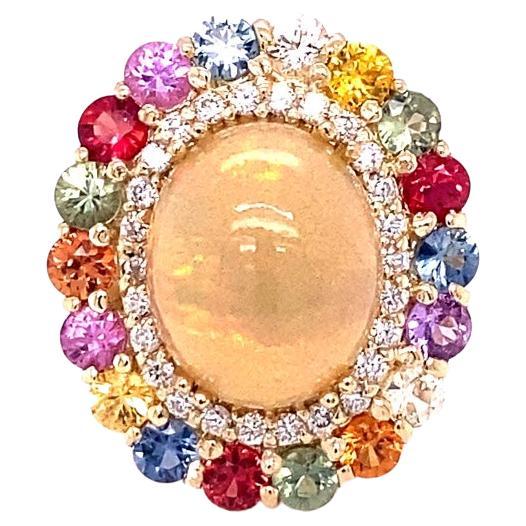 8.89 Carat Natural Opal Multi Sapphire Diamond Yellow Gold Cocktail Ring

Unique and beautifully designed cocktail ring that can be a great addition to anyone's accessory collection!   

This ring has a 5.32 Carat Oval Cut Opal and is surrounded by