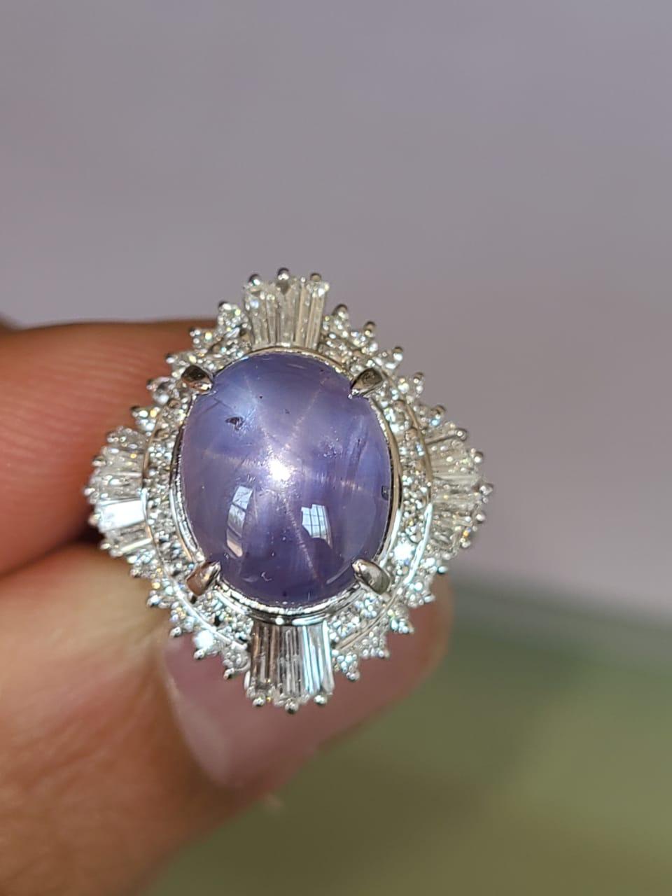 A beautiful and classic ring set in platinum PT 900 with Natural star blue sapphire and diamonds . The star sapphire is completely natural and weight is 8.90 carats and natural diamond weight is .87 carats.  The ring dimensions in cm 2 x 2 x 2.6