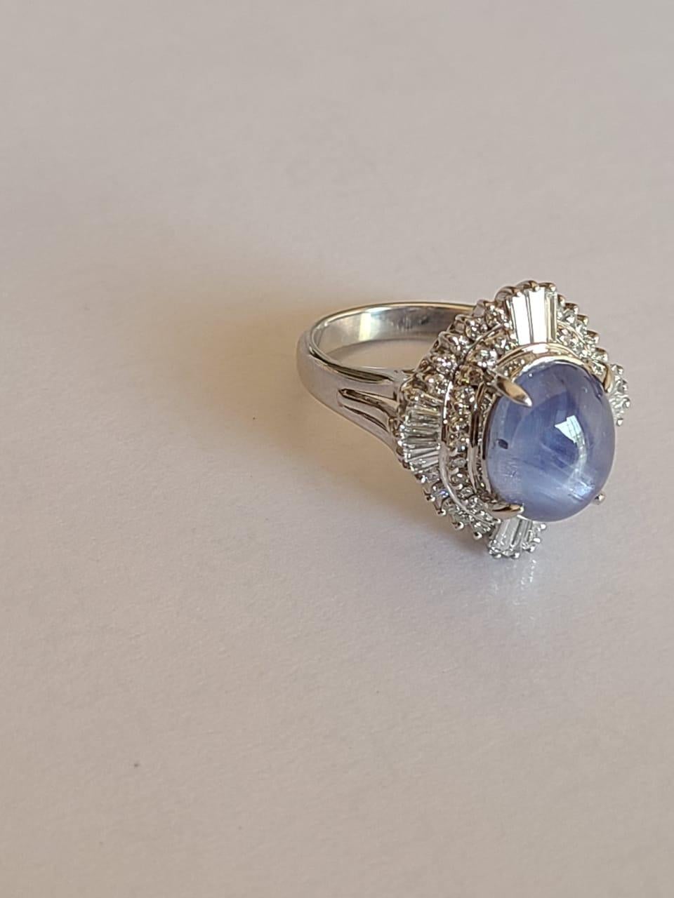 Oval Cut 8.90 Carat Natural Star Sapphire Ring Set in Platinum with Diamonds