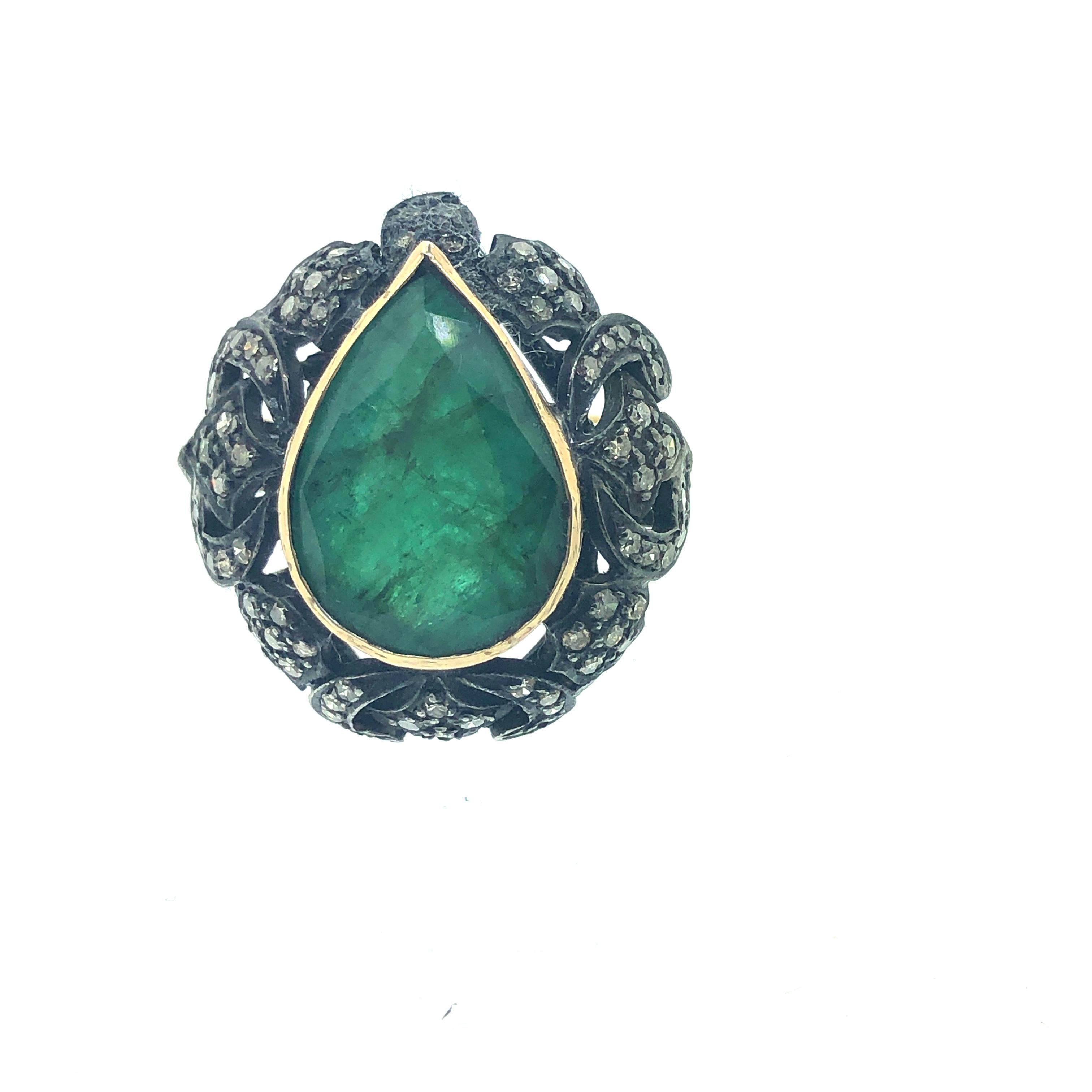 6.75 Size 8.90ct Emerald, 0.90ct Diamond Ring in Oxidized Sterling Silver, 18k Gold. The beautiful emerald in pear shape is set in the center with diamonds all around it. The emerald is bezel set with 18K Gold. The ring shank is made with 18K Gold