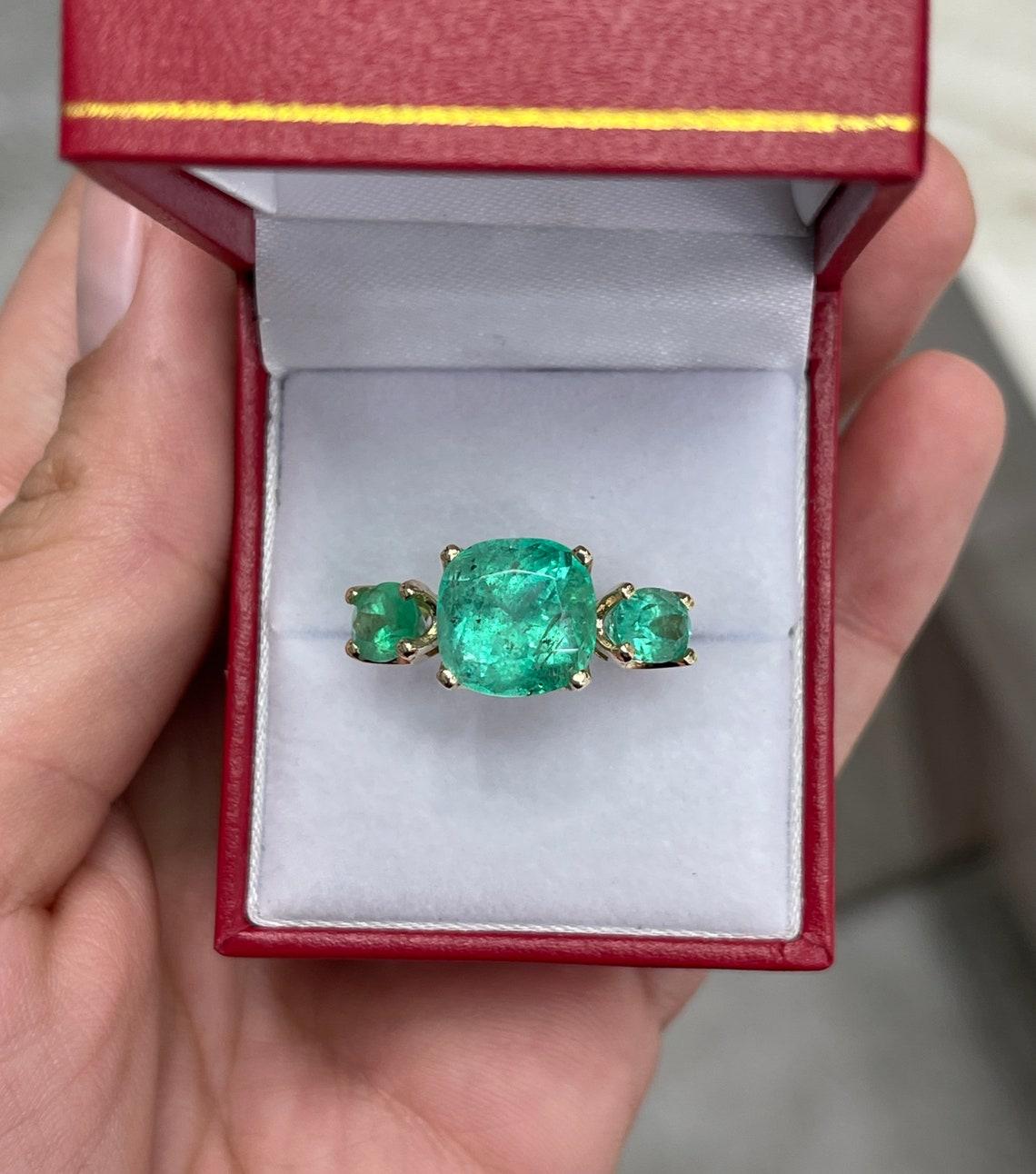 Modern 8.90tcw 14K Three Stone Emerald Cushion & Oval Cut Gold Ring For Sale