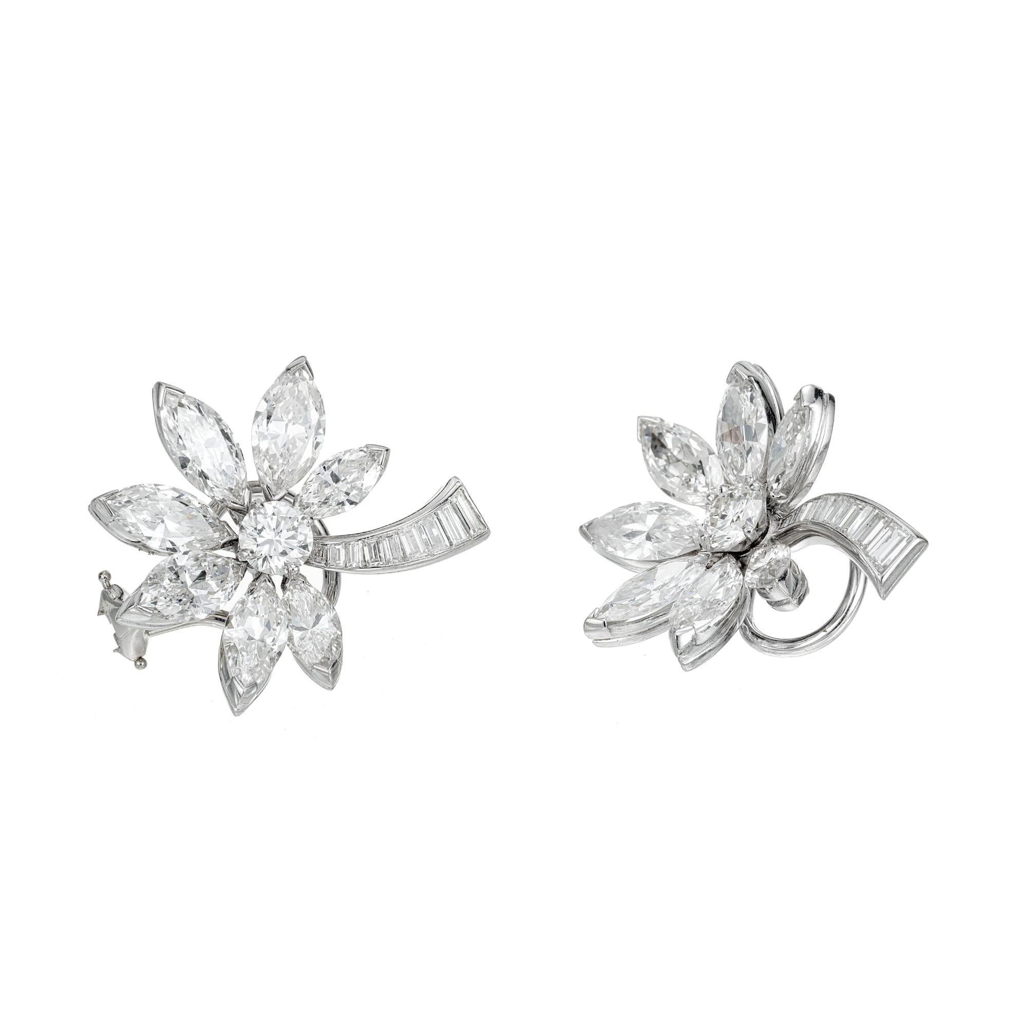 Handmade diamond Platinum and 14k white gold flower design earrings. Round, baguette and marquise diamonds in a flower shaped, clip post setting. Omega clip backs and posts. The baguette section goes up and the Marquise point down. 

2 round