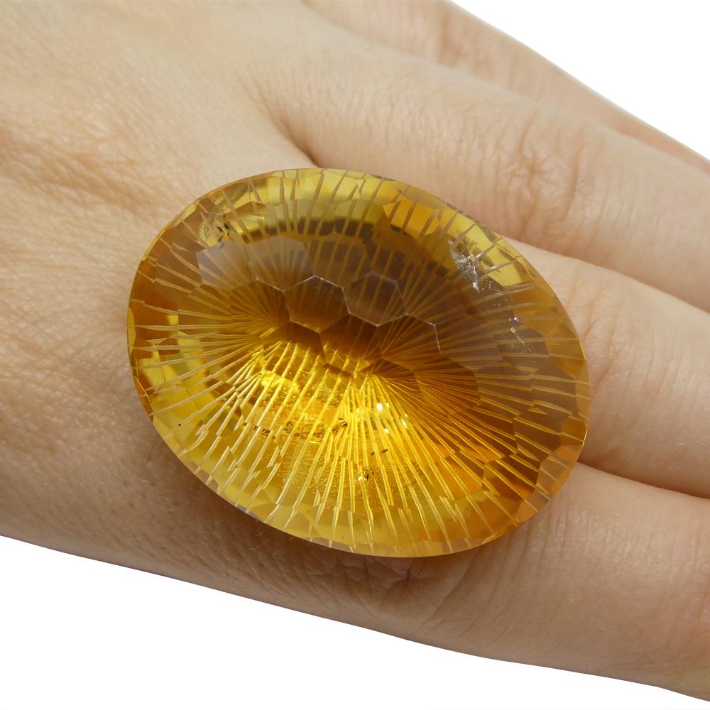 Description:

Gem Type: Citrine
Number of Stones: 1
Weight: 89.12 cts
Measurements: 35.40 x 27.25 x 17.83 mm
Shape: Oval
Cutting Style Crown: Honeycomb
Cutting Style Pavilion: Brilliant Cut
Transparency: Transparent
Clarity: Slightly Included: Some