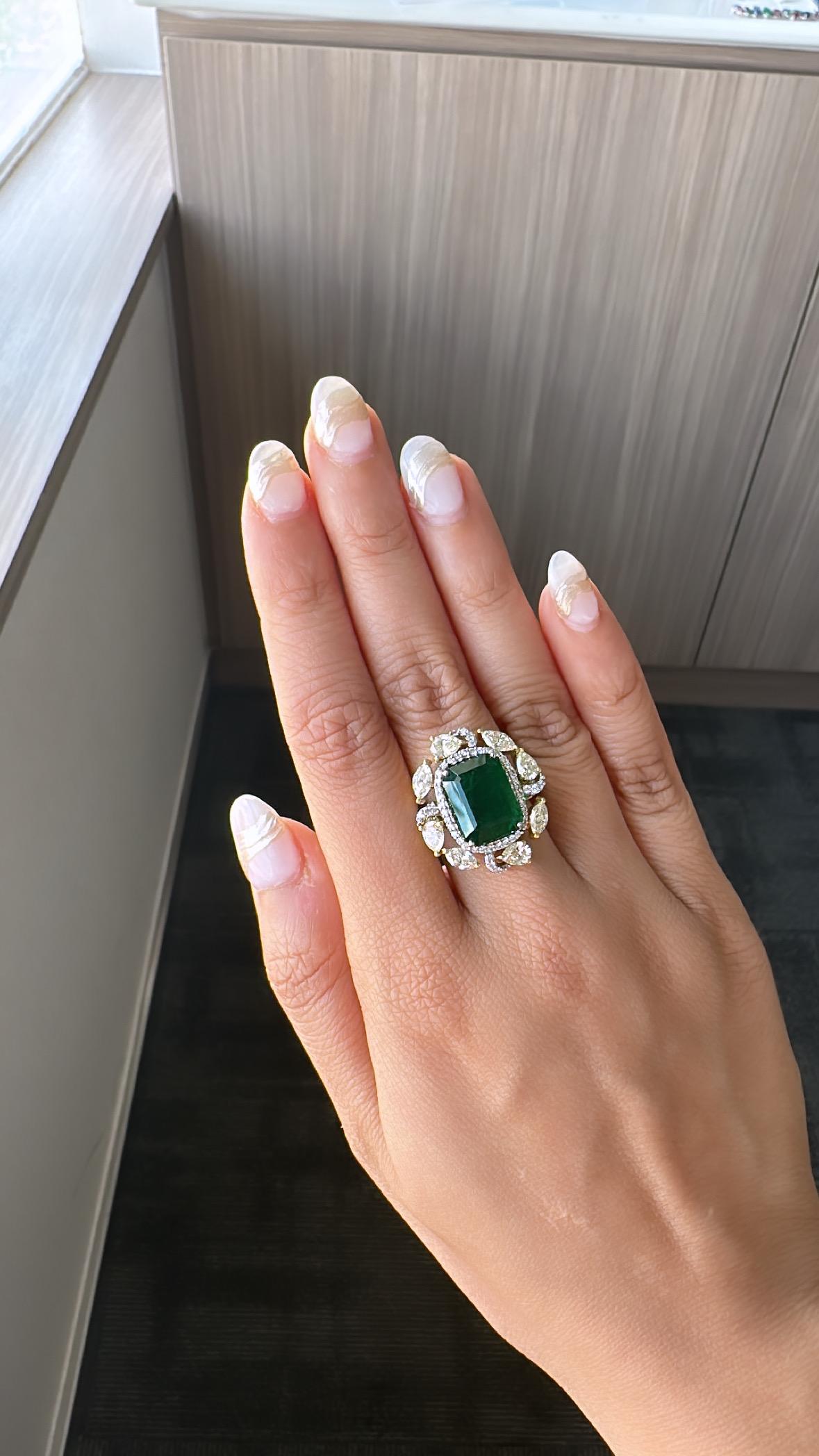 A very gorgeous and one of a kind, Emerald Cocktail / Engagement Ring set in 18K White Gold & Diamonds. The weight of the Emerald is 8.92 carats. The Emerald is completely natural, without any treatment and is of Zambian origin. The weight of the