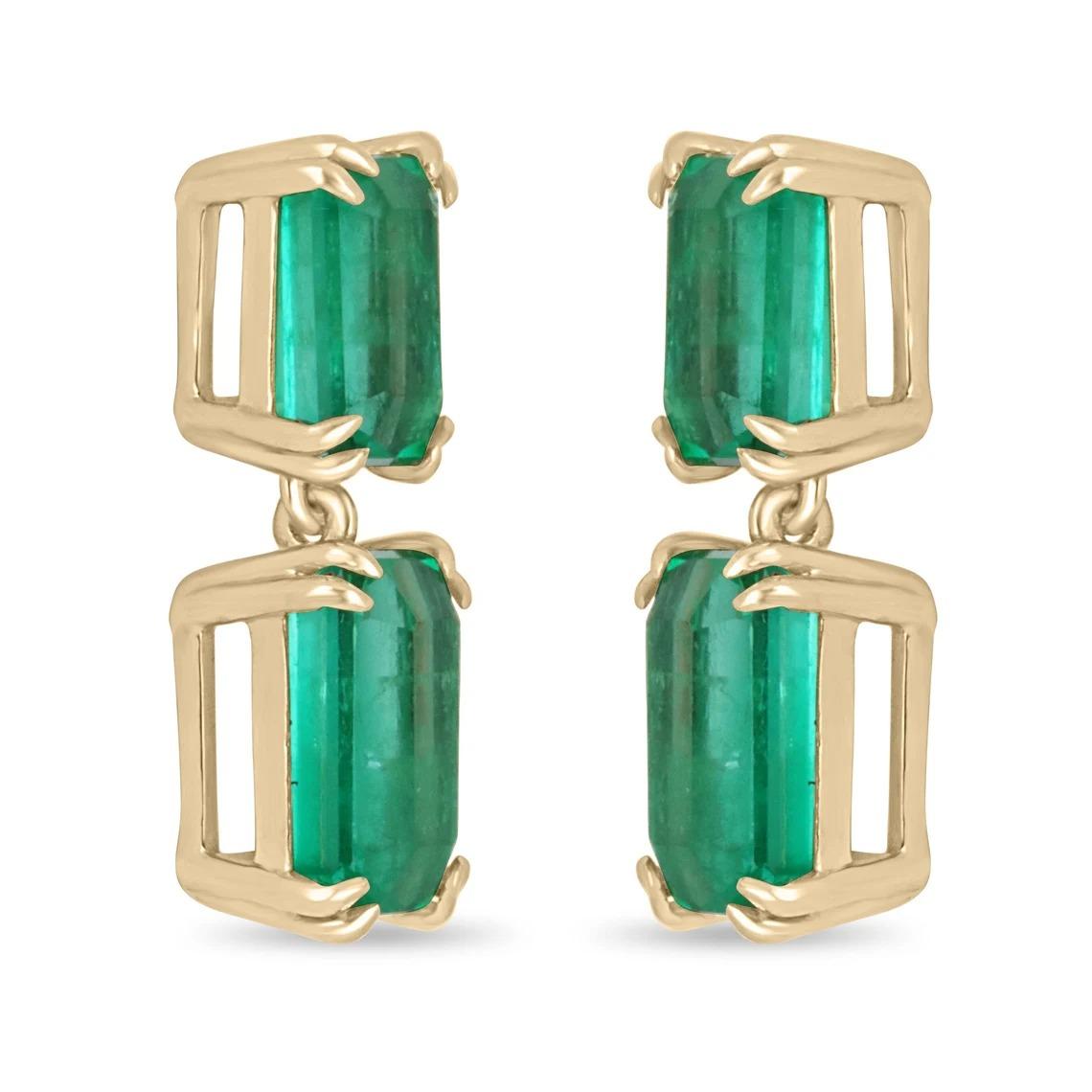 Fine Top Quality AAA++ emerald dangling drop studs dexterously handmade in solid fine 18K yellow gold. Displayed are the finest grade, emerald cut, Muzo emeralds with excellent transparency, accented by a simple secure four-prong gold mount,