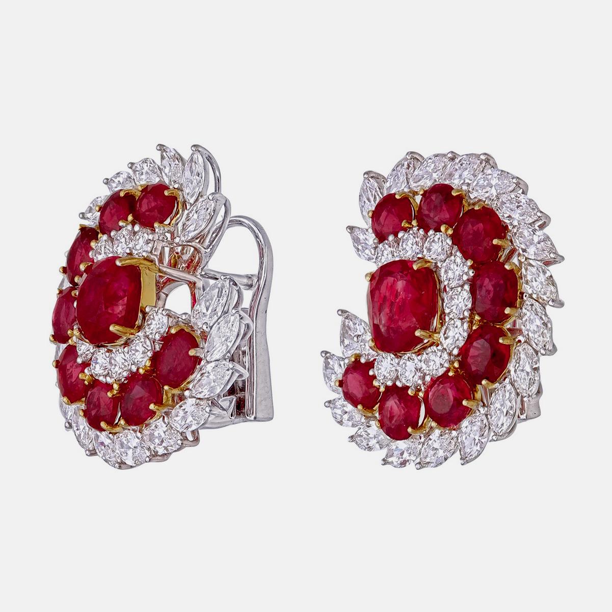 An elegant pair of  ruby and diamond earrings from Rewa Jewels is made in 18 karat white gold.

The centre piece is of natural untreated Burmese rubies  weighing approximately 1.86 carat and 1.84 carat each. Surrounded with 16 rubies weighing